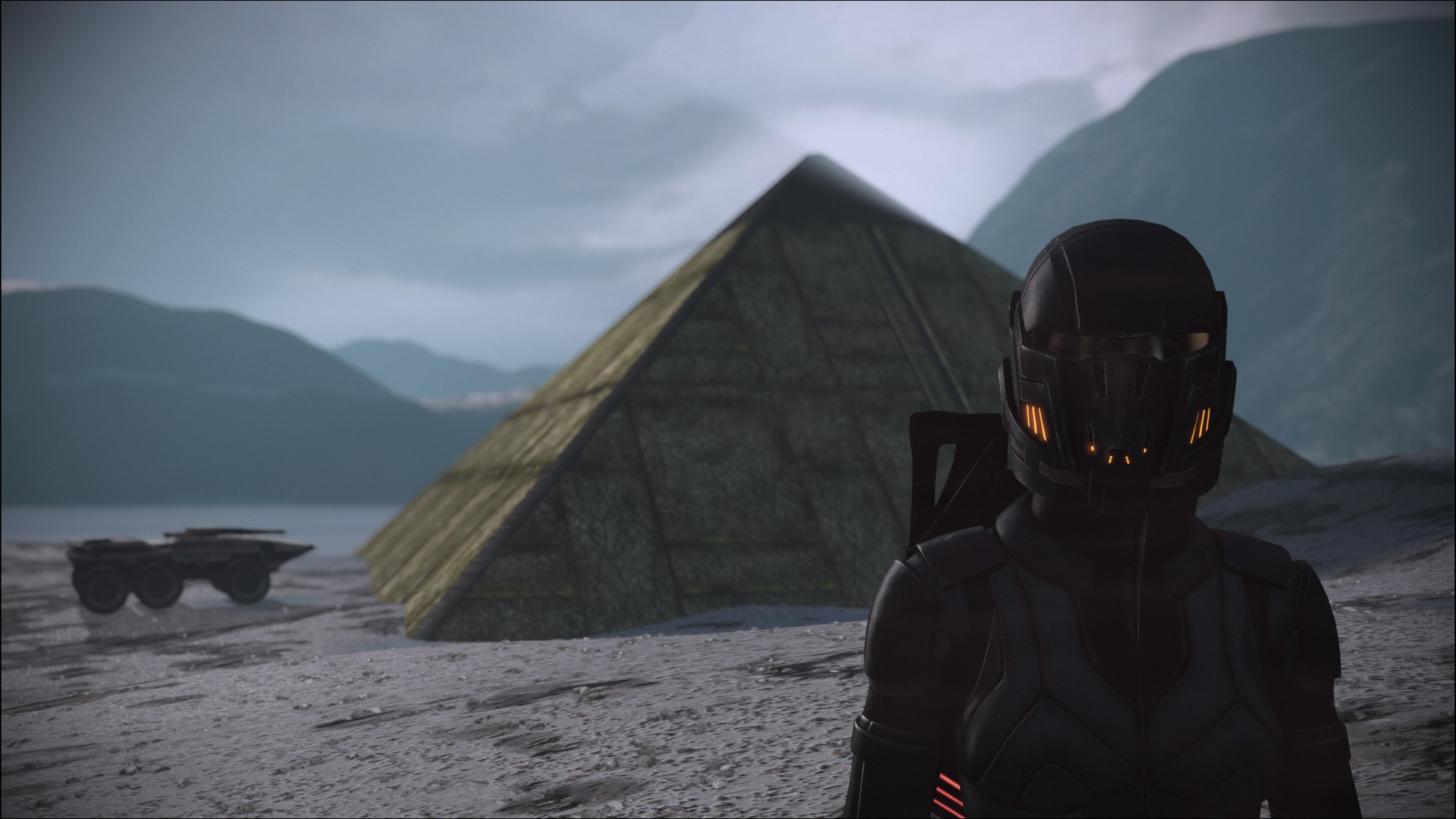 Shepard stood in front of a prothean pyramid on a random planet. The Mako is also there.
