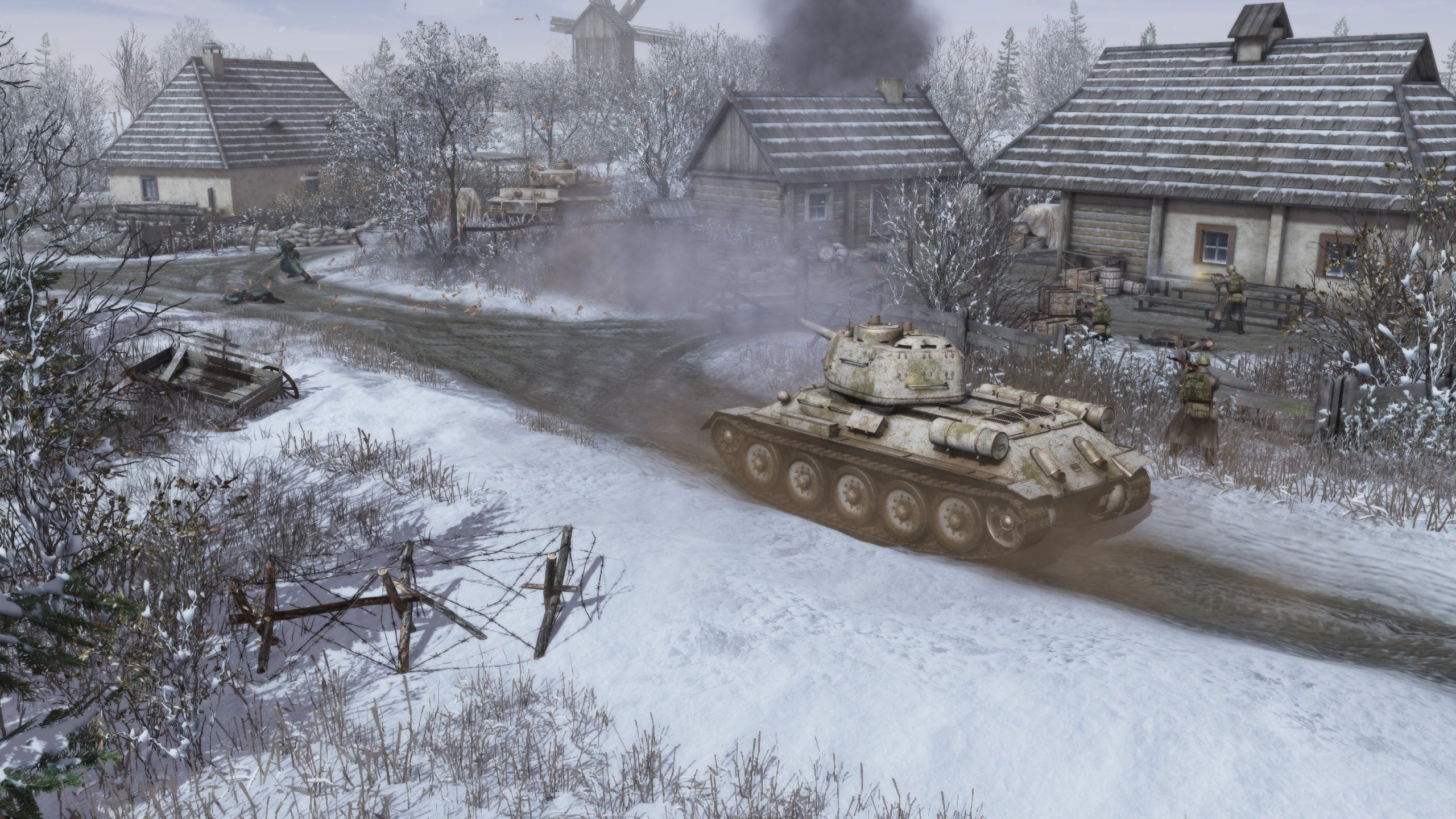 Tanks roll through a snowy village in Men Of War 2