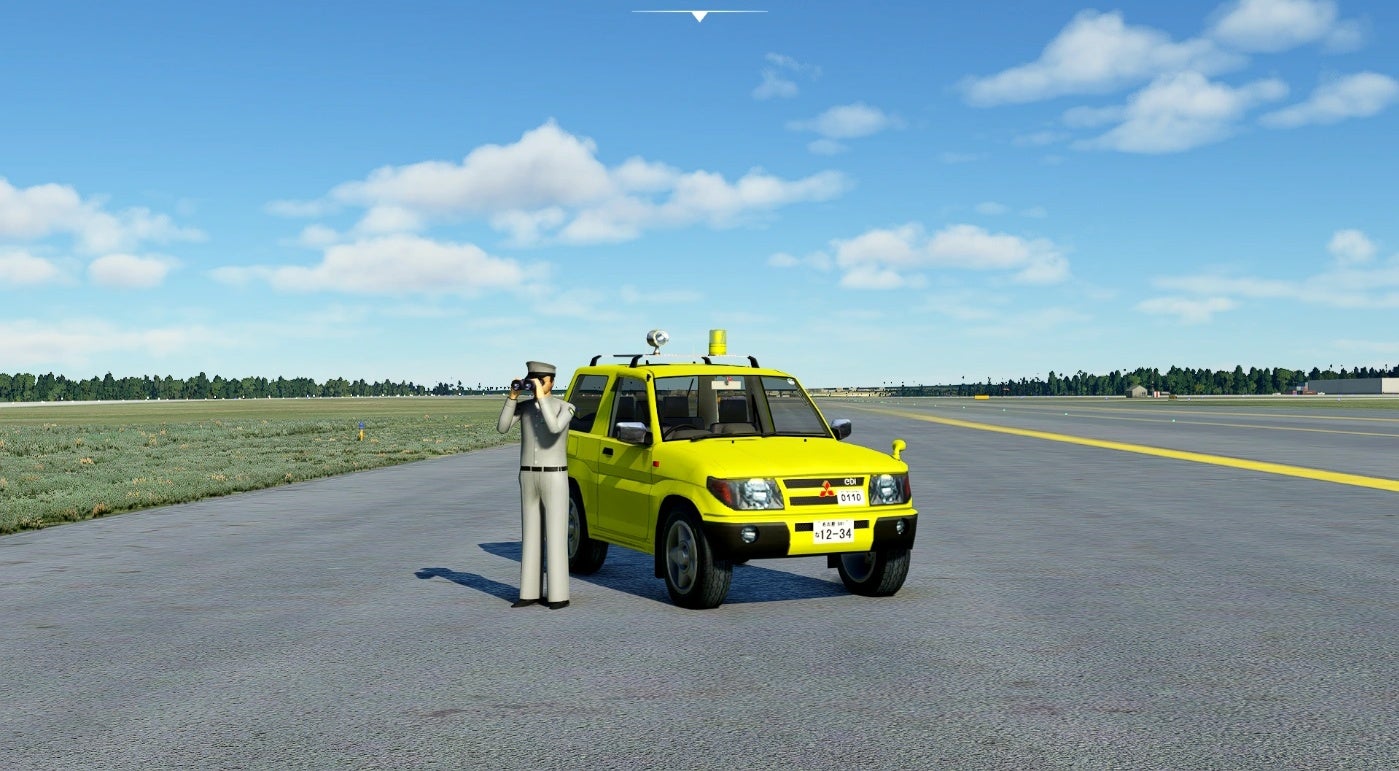A screenshot of Microsoft Flight Simulator showing a yellow Mitsubushi car parked on a runway, with a Playmobil-looking fellow standing next to it, peering through binoculars.