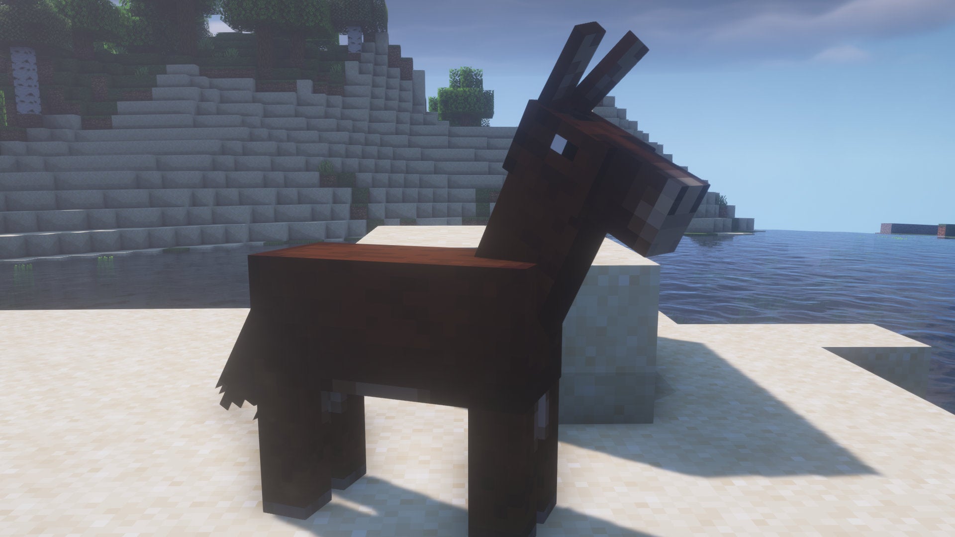 A Minecraft screenshot of a Mule standing on a beach.