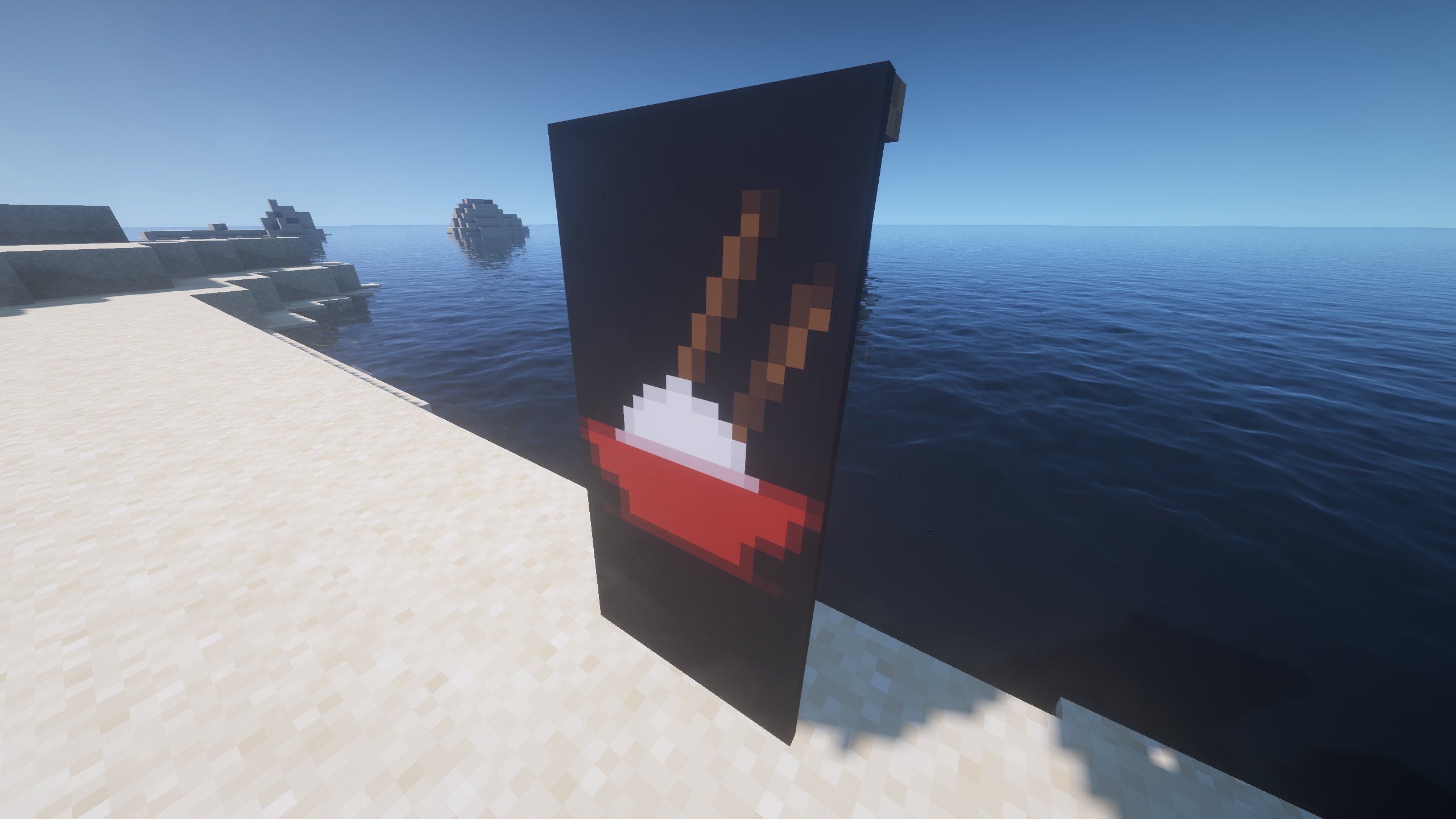 An Enderman eyes Banner in Minecraft, placed in the ground by the coast.