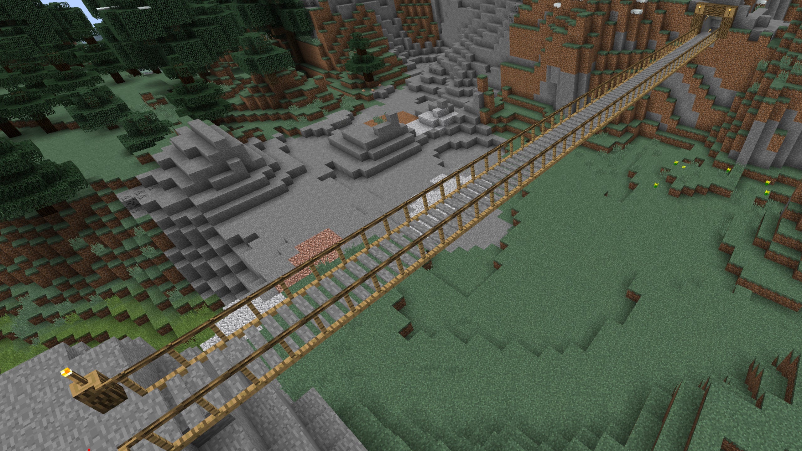 A screenshot of a wood and stone bridge in Minecraft made using the Chisels and Bits mod.