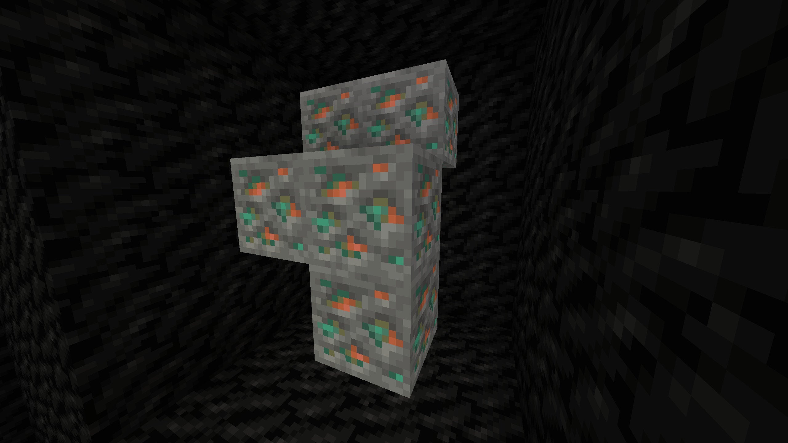 A Minecraft screenshot of a vein of Copper Ore, dug out and surrounded by Coal Blocks.