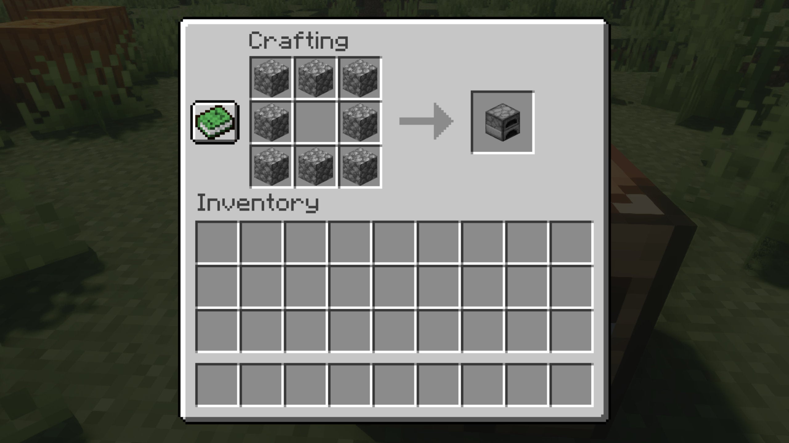 The Crafting Table window in Minecraft, inside which the player is crafting a stone furnace.