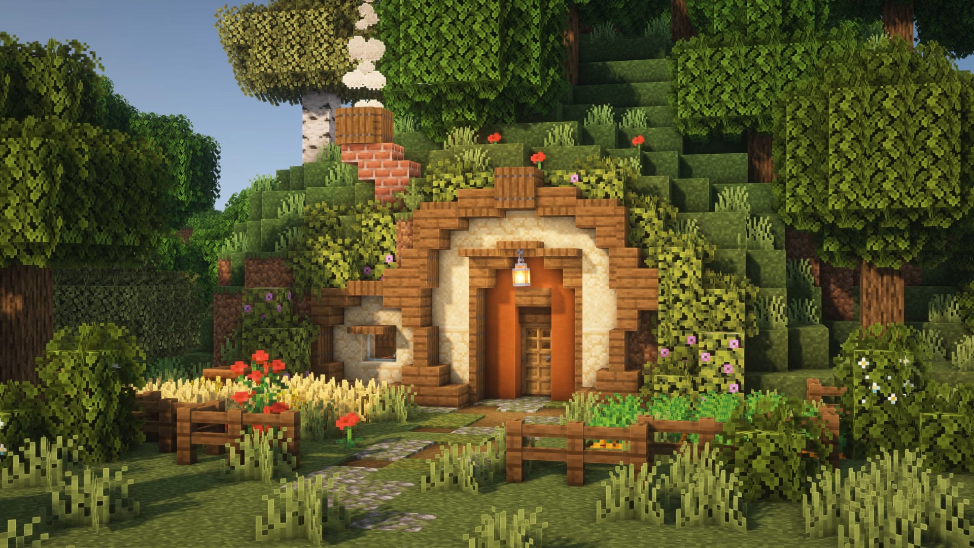 A house in Minecraft inspired by a hobbit hole from Lord Of The Rings, built by YouTuber Goldrobin.