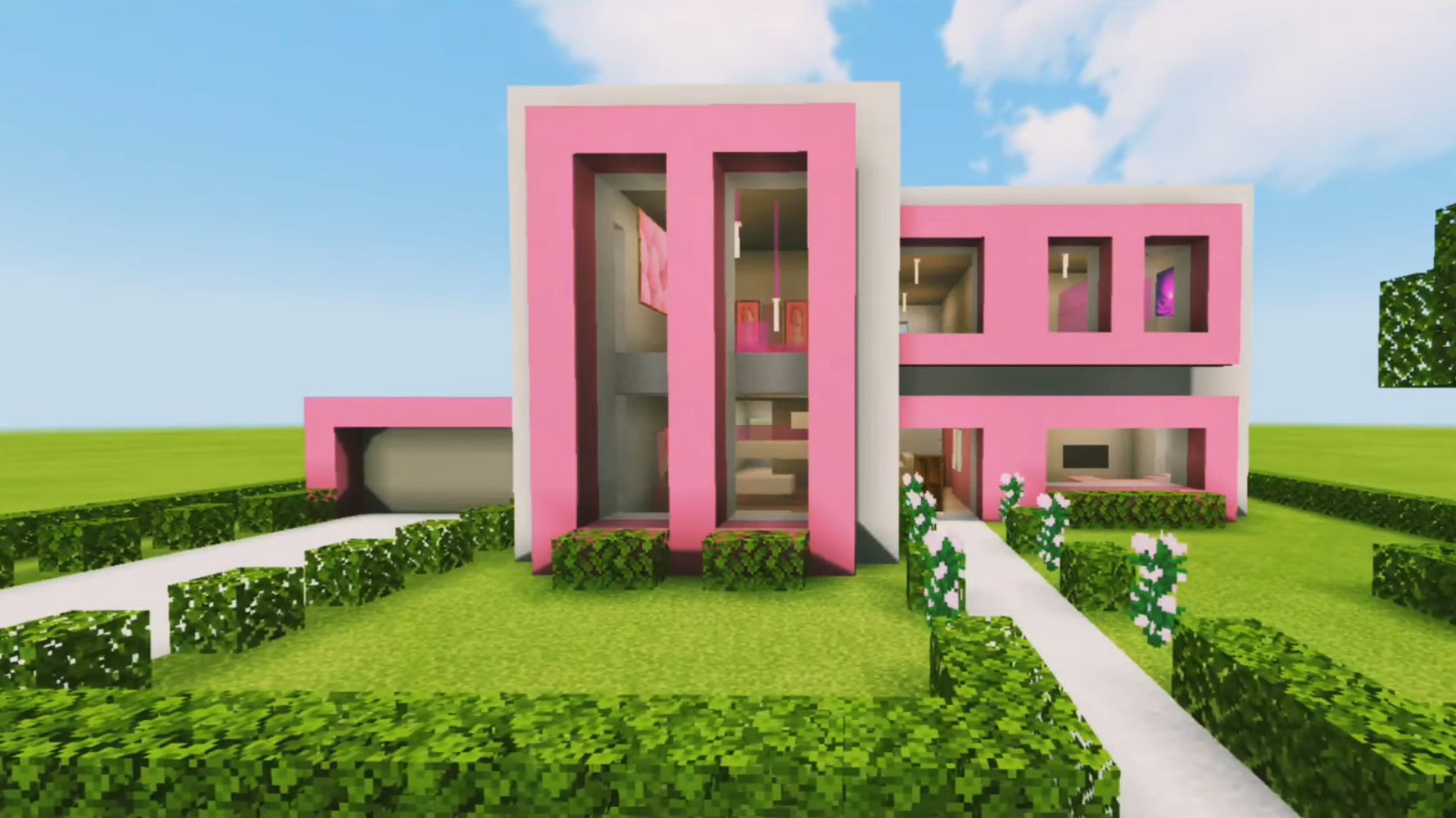 A pink modern house in Minecraft, built by YouTuber Kam The Builder.