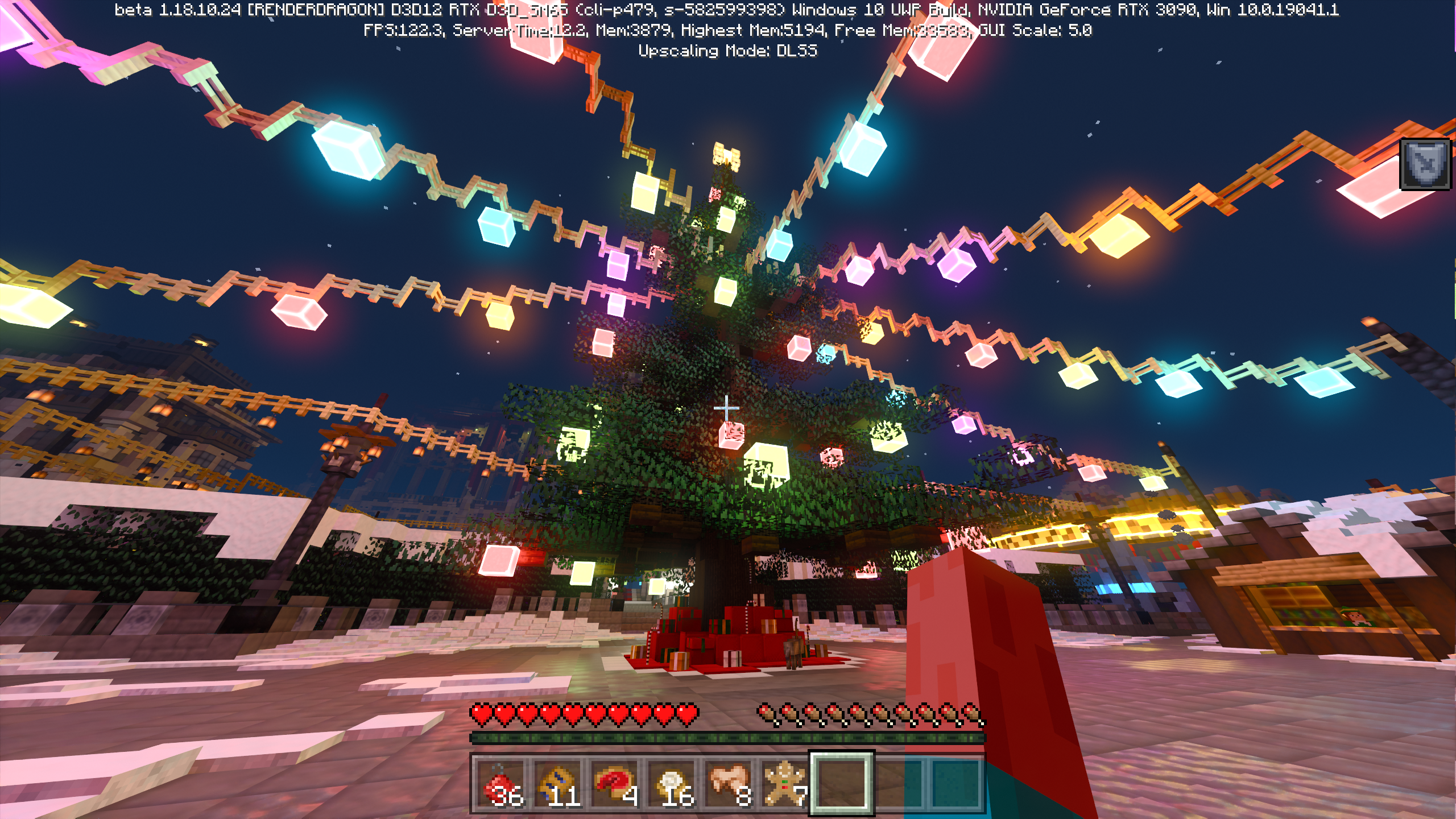 Uma árvore de Natal gigante, completa com luzes e presentes, no mapa Minecraft RTX Winter World da Nvidia.