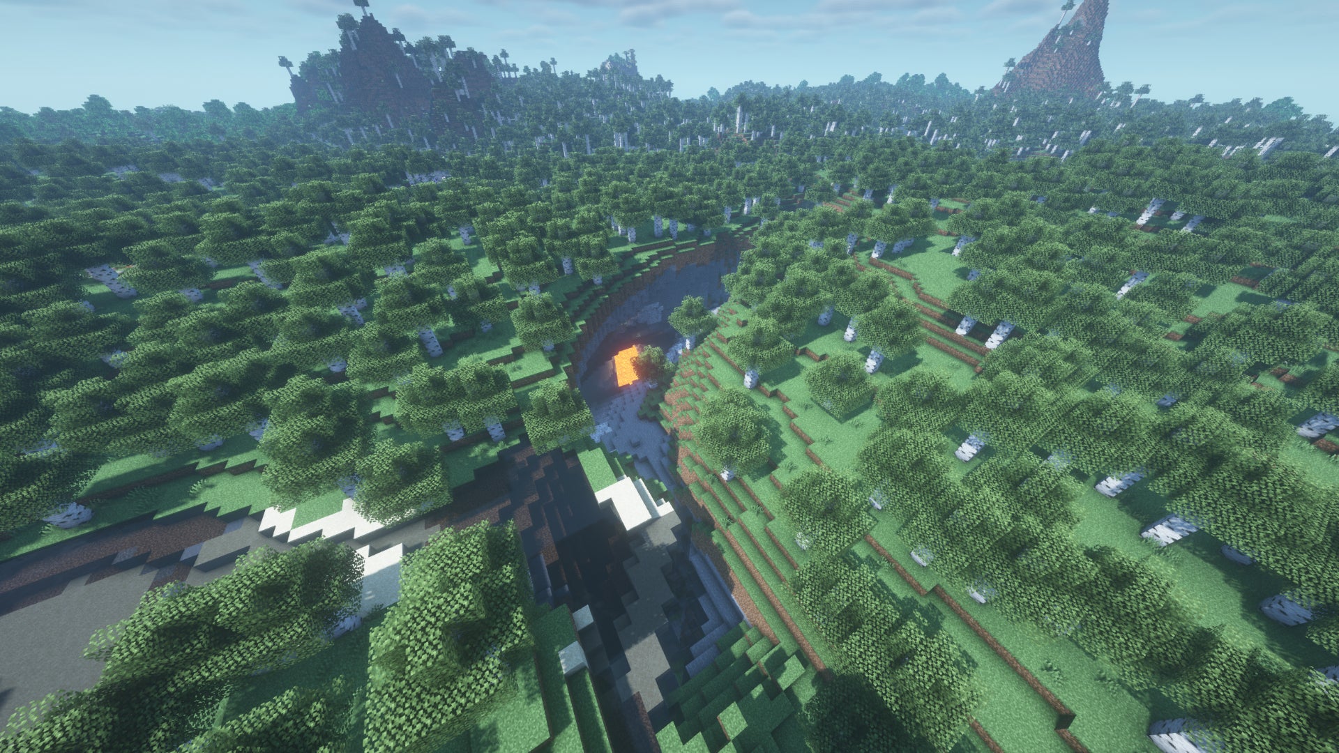 A Birch Forest in Minecraft, with a curved ravine in the foreground leading underground.