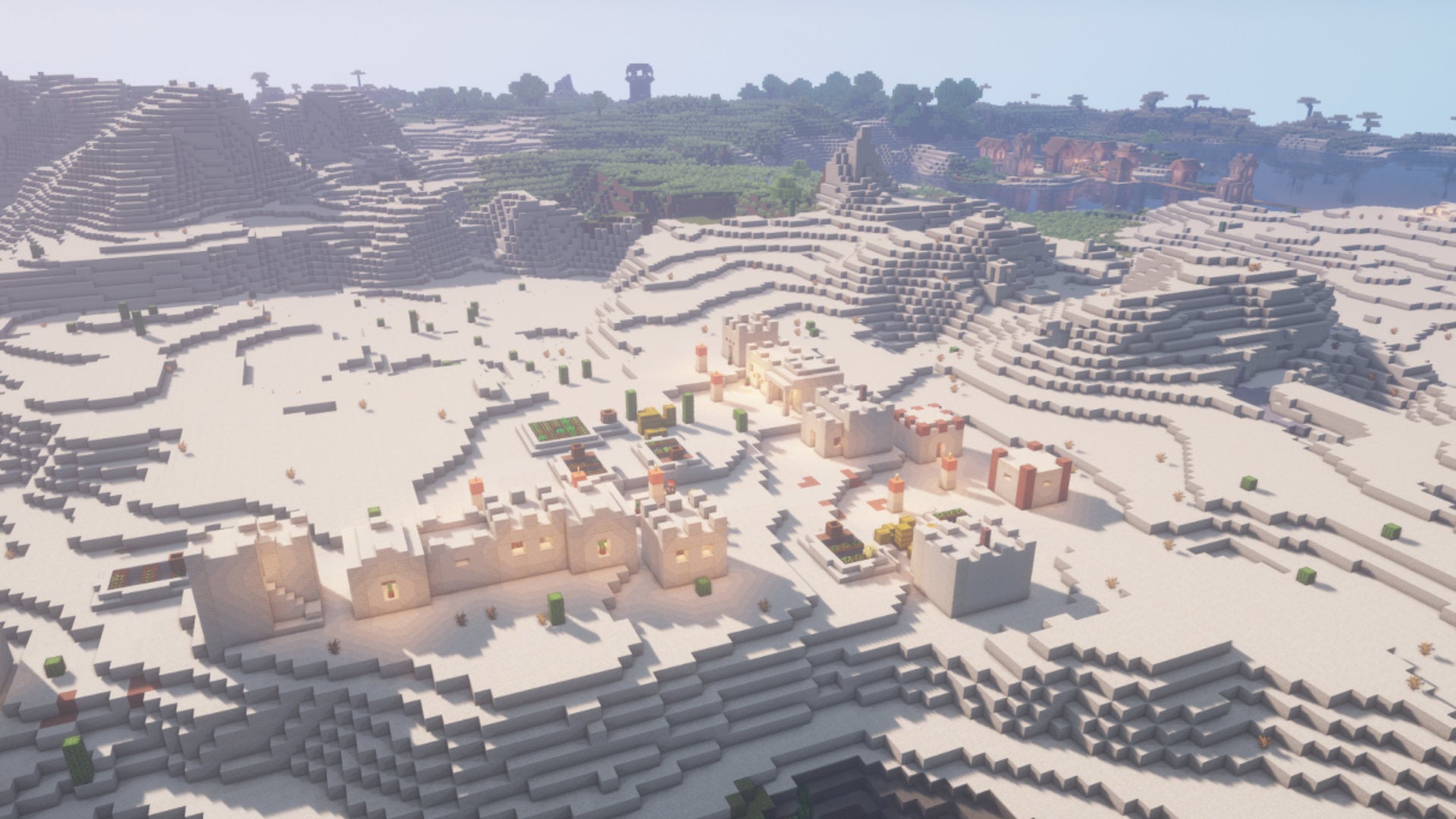 A desert village in Minecraft, viewed from an aerial perspective with shaders enabled.