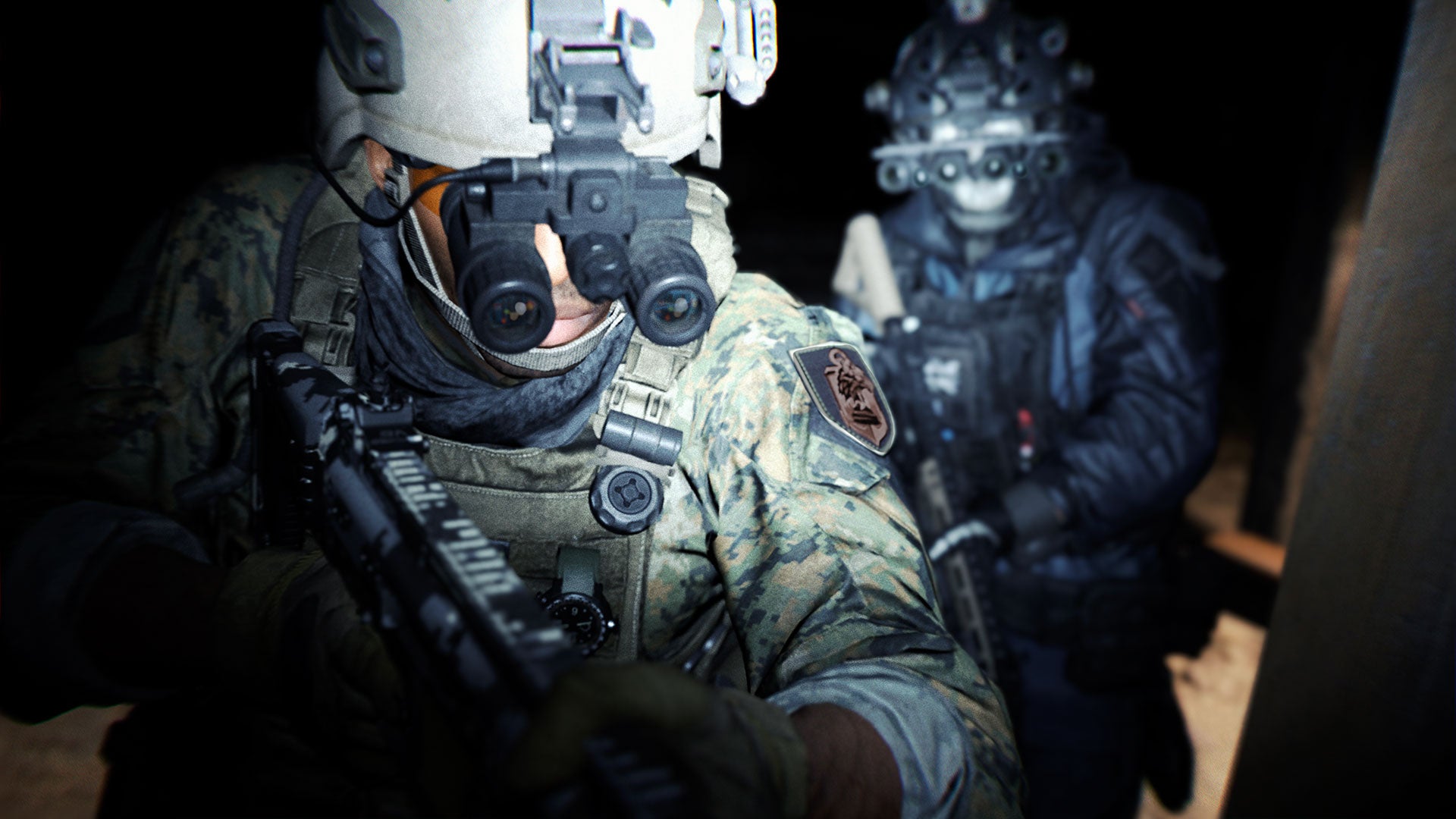 Two soldiers in Modern Warfare 2 wearing night vision goggles in a corner one after the other.
