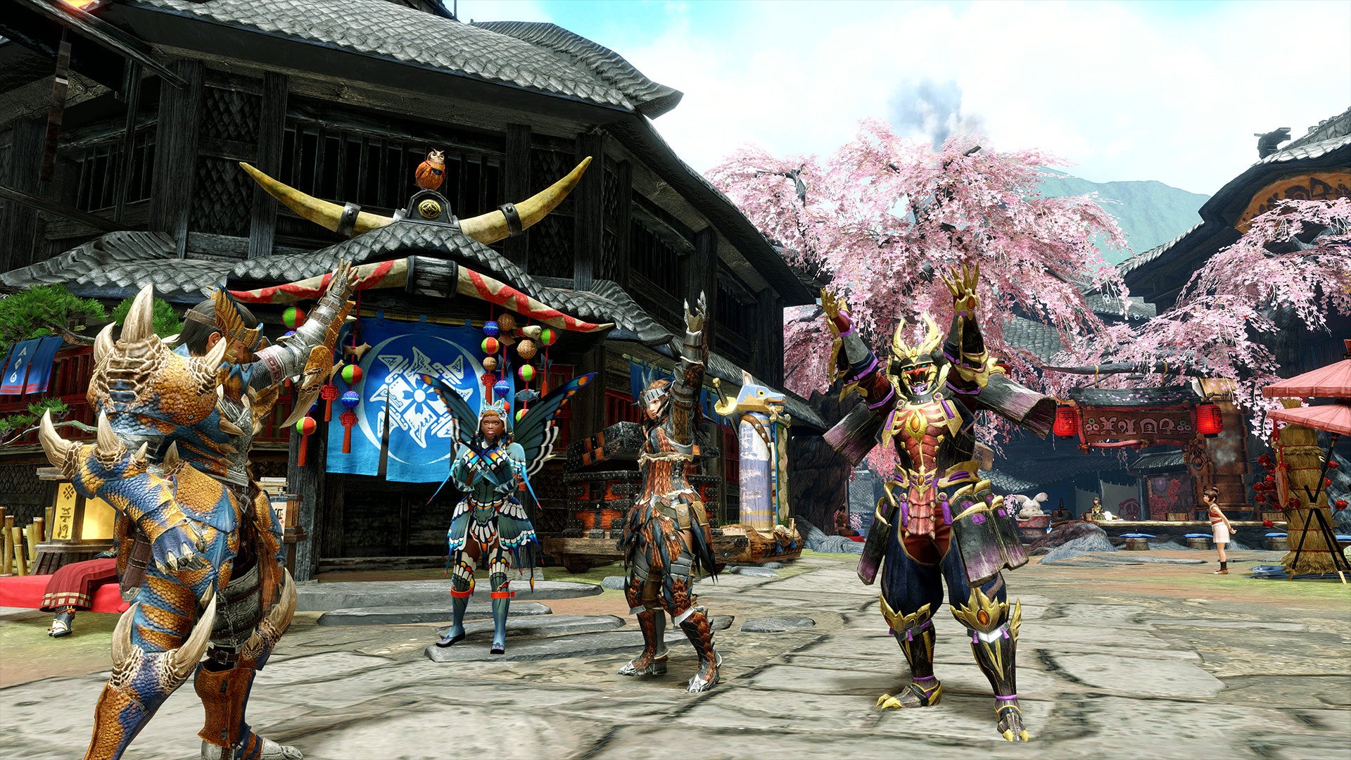 Four player-controller Monster Hunter Rise characters cheering together in the plaza of Kamura Village.