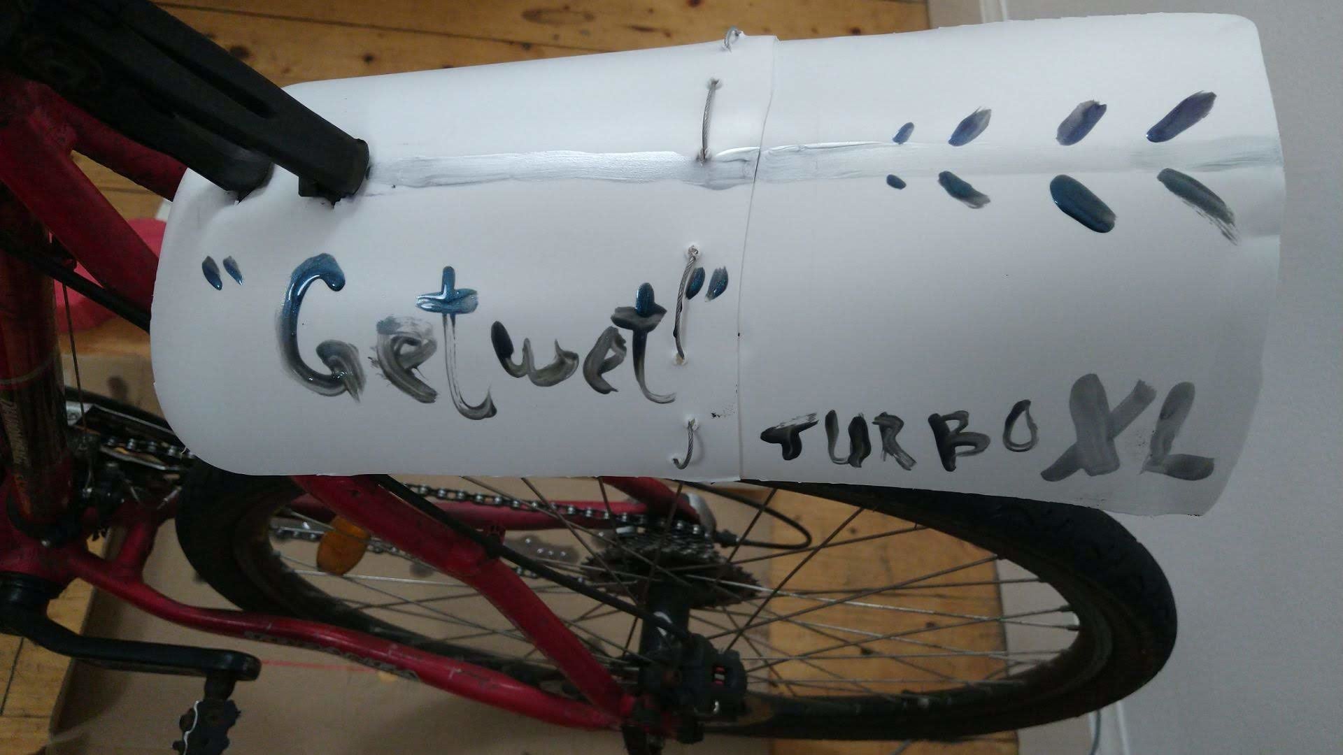A photo of the temporary mudguard I made for my bike.