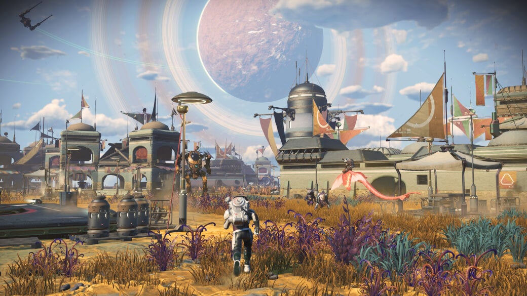 No Man's Sky frontiers update - A player on the surface of a yellow grassy planet runs towards a settlement full of buildings