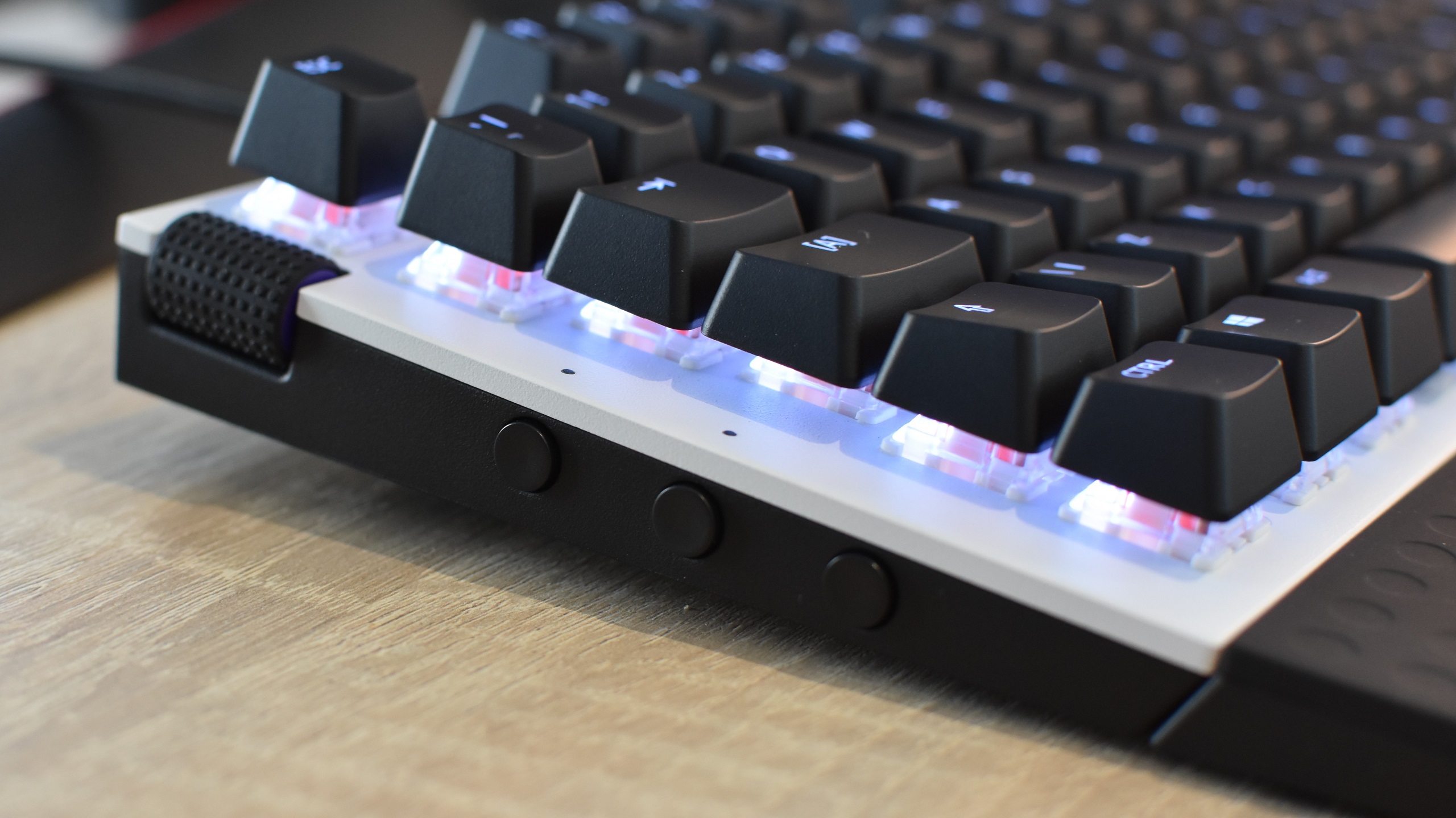The side buttons on an NZXT Function Mini-TKL gaming keyboard.