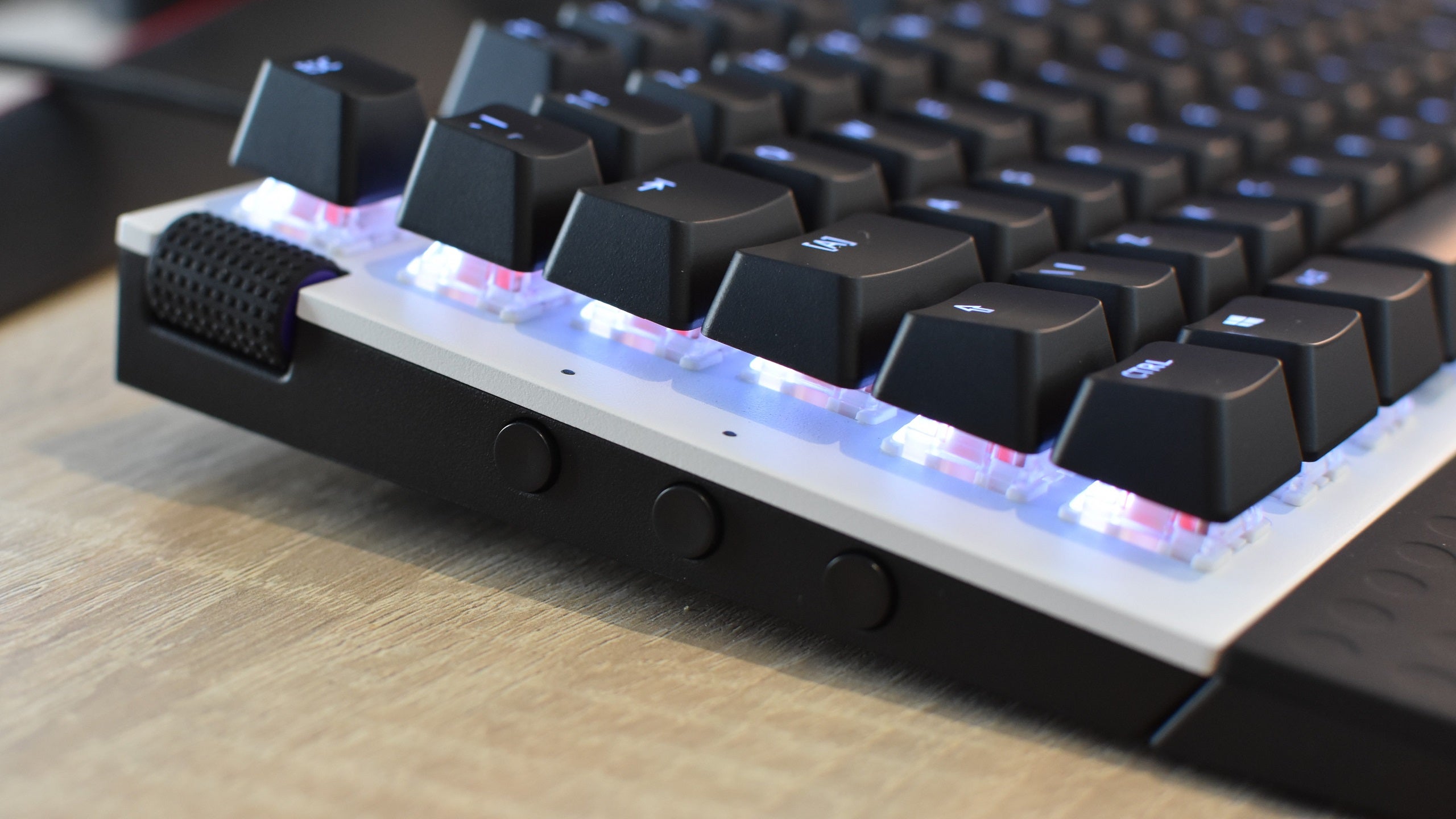 The side buttons of an NZXT Function Mini-TKL gaming keyboard.