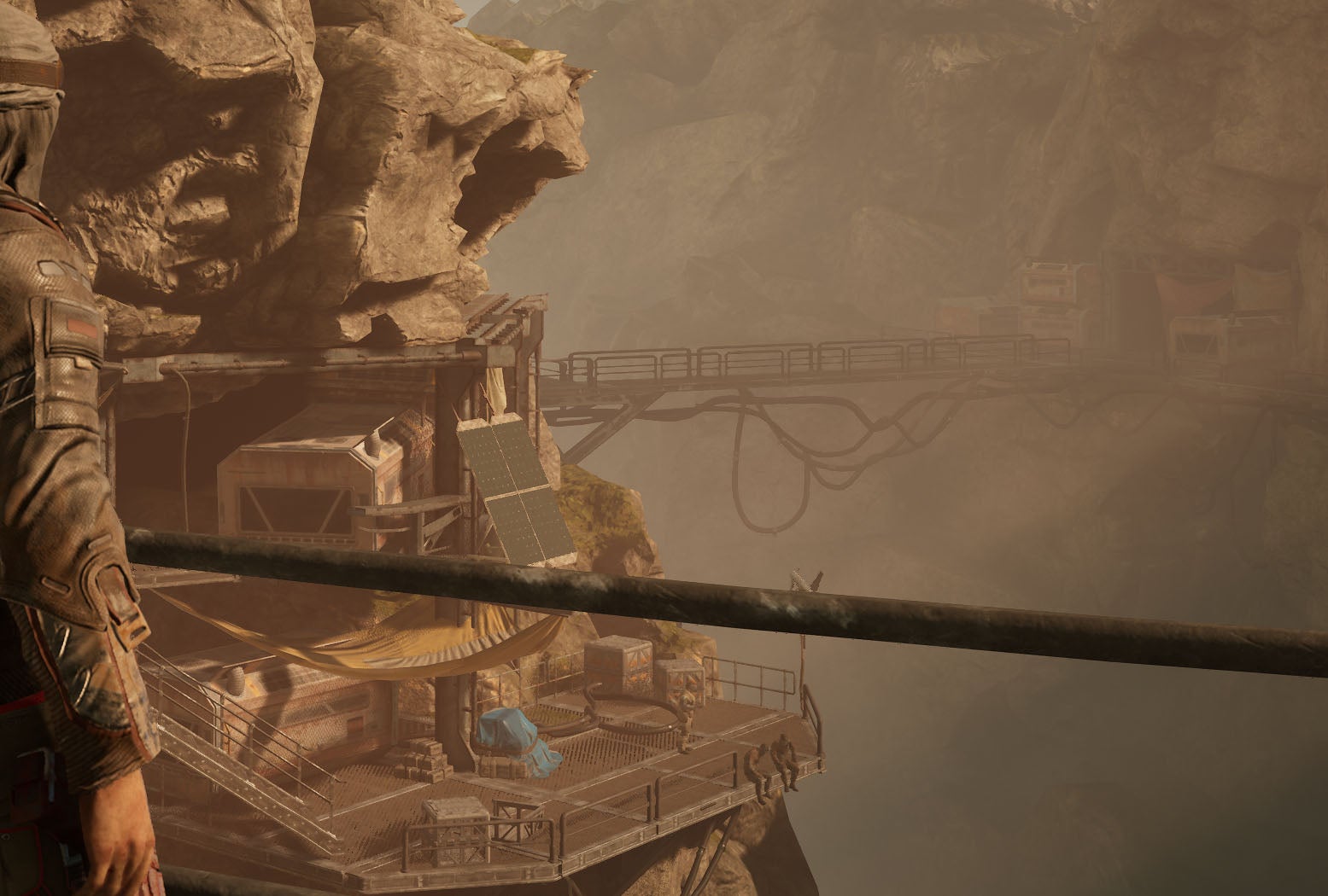 A close-up of an industrial lookout point in a rocky valley in Outriders, at 4K Ultra settings (native)