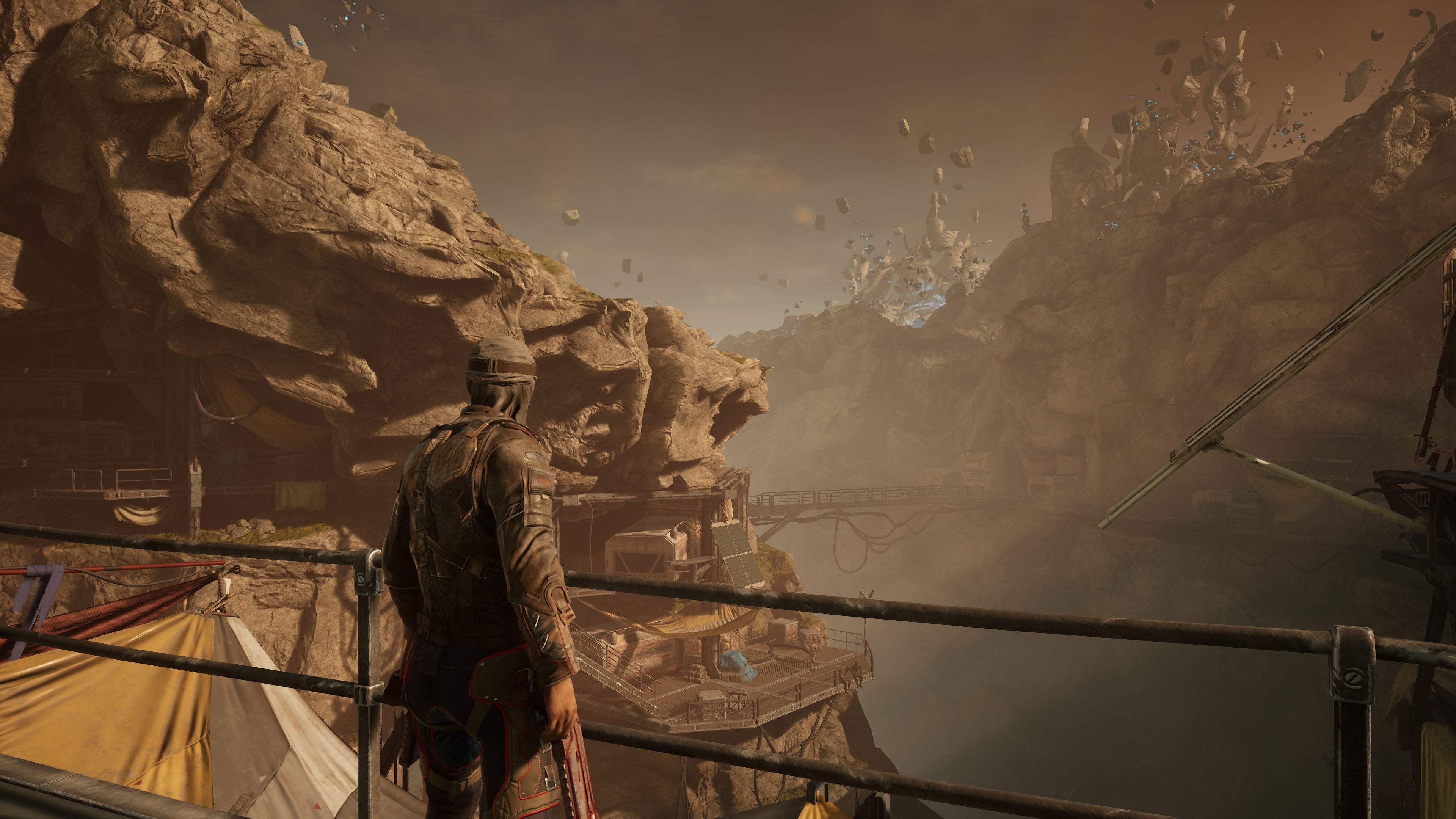 A player character looking out over a rocky valley in Outriders, running at 4K Ultra settings (native)