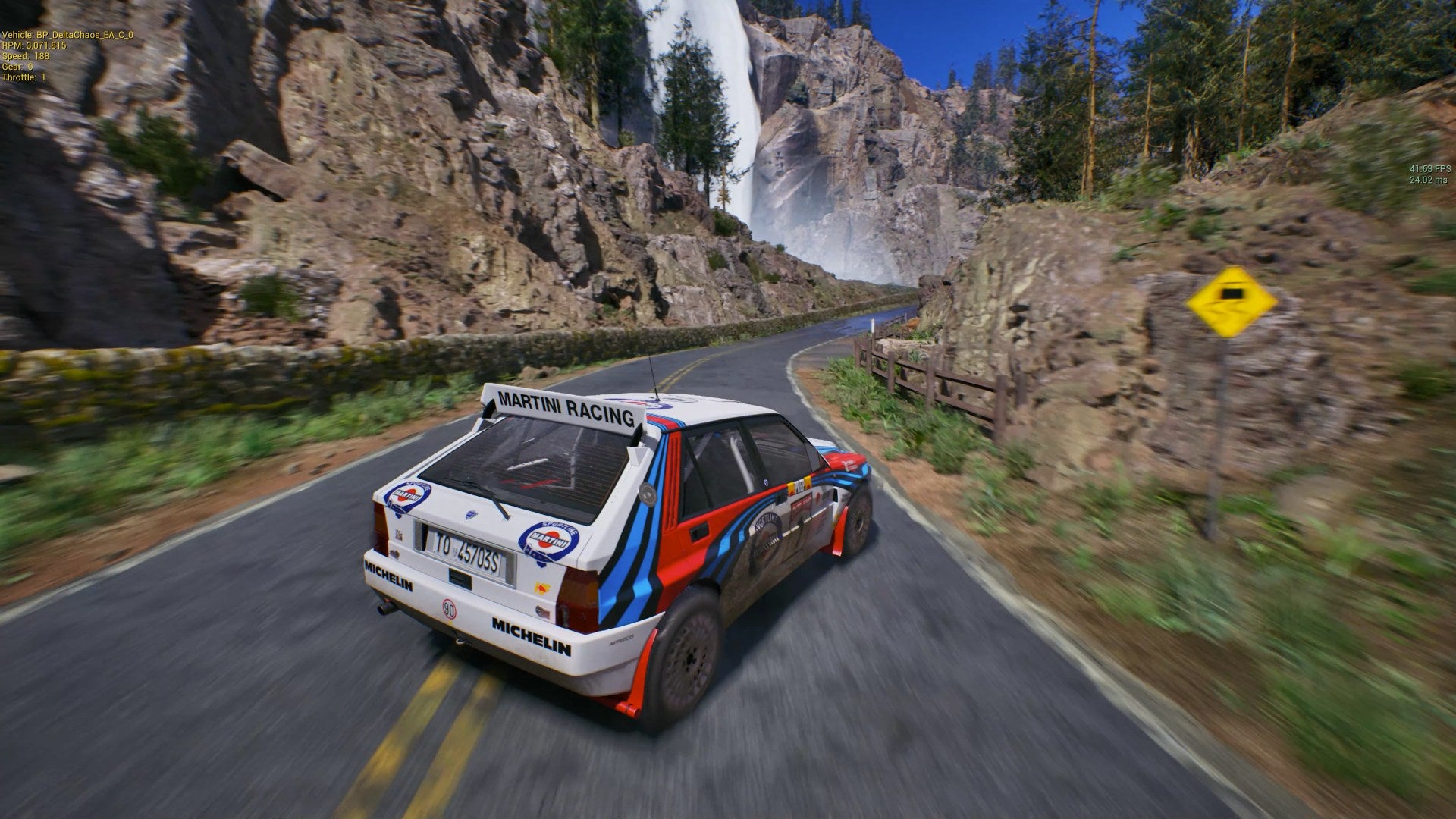 A car whizzes around a track with a waterfall in the distance in Over Jump Rally, a fanmade Sega Rally tribute.