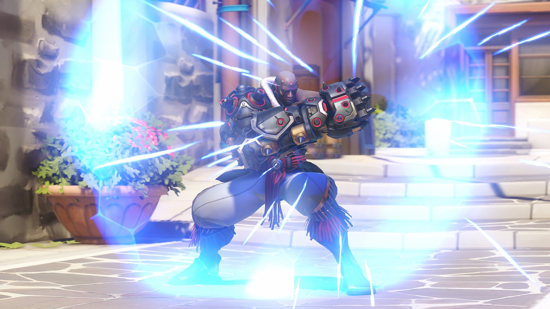 Doomfist, a hero in Overwatch 2, stands in front of the camera using his Power Block shield to deflect attacks.