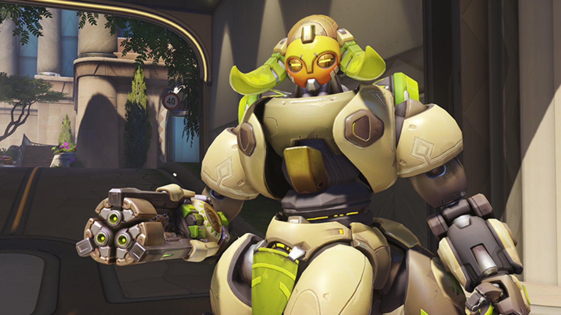 Orisa stands in front of the camera in Overwatch 2 with her turret ready.
