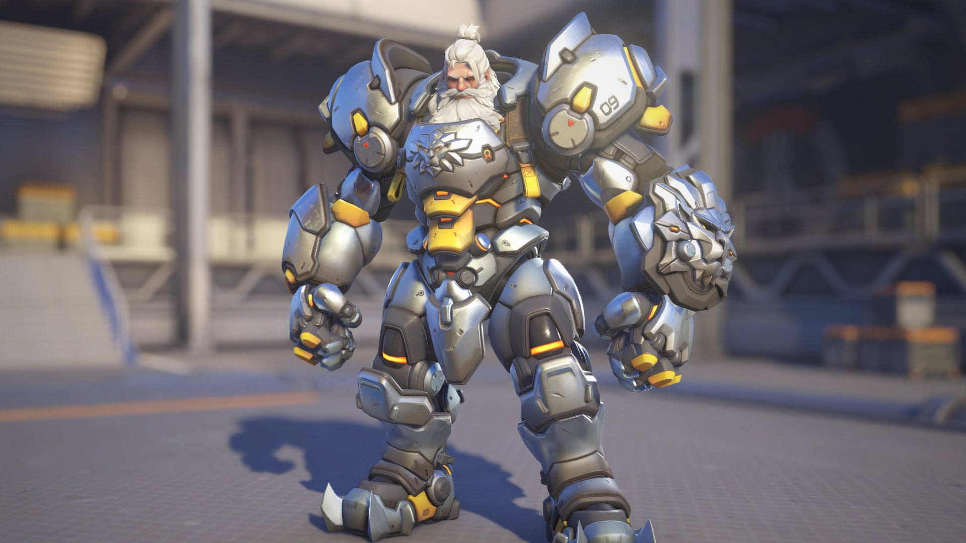 Reinhardt, a hero in Overwatch 2, poses before the camera in the hero selection screen.