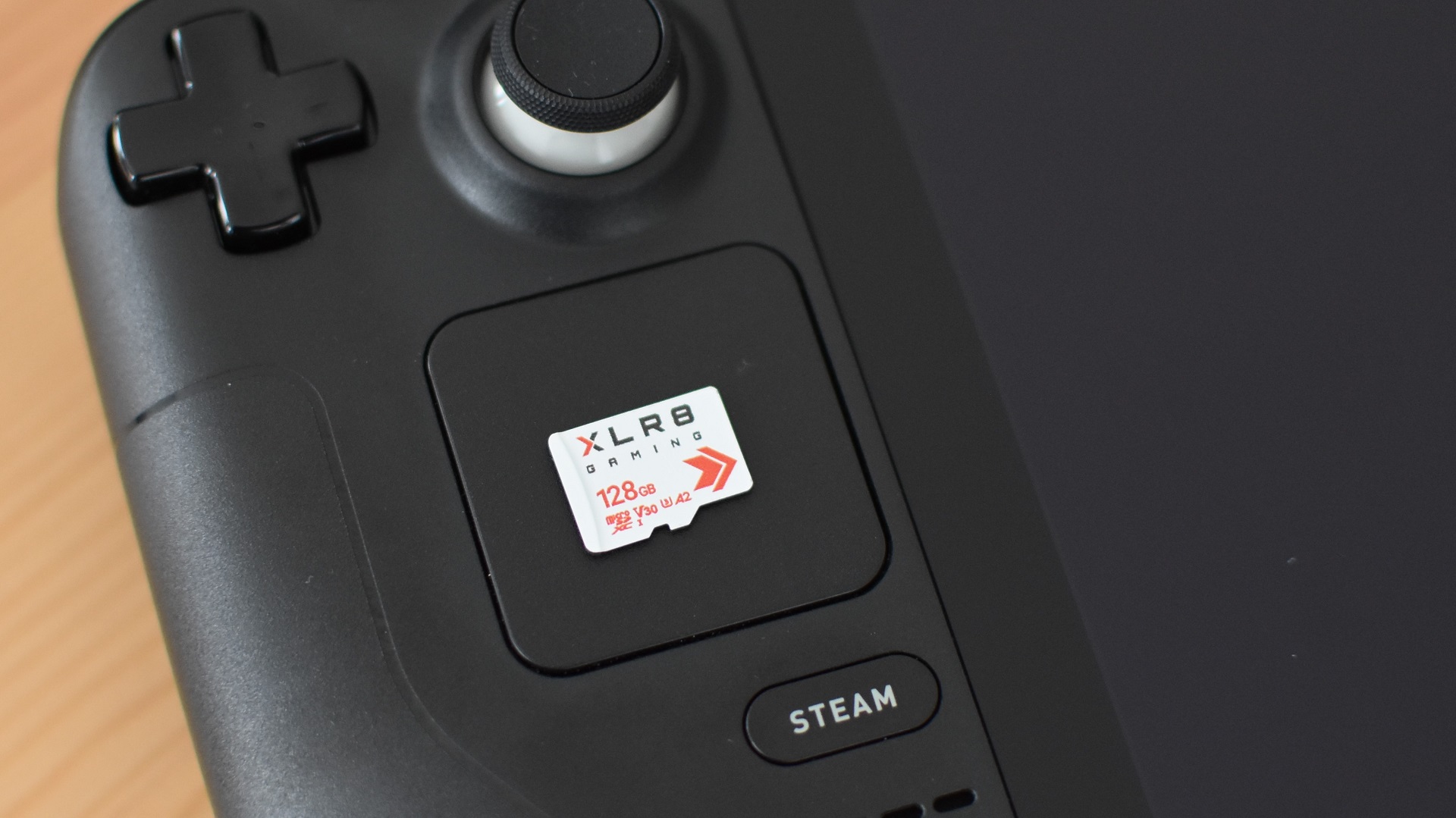 A PNY XLR8 microSD card on top of a Steam Deck.