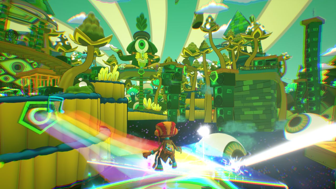 A level landscape in Psychonauts 2, a world of green and yellow towers made of strange plants and stacks of amps. In the distance is a giant statue of a person whose entire head is a giant eye. They're holding a green violin
