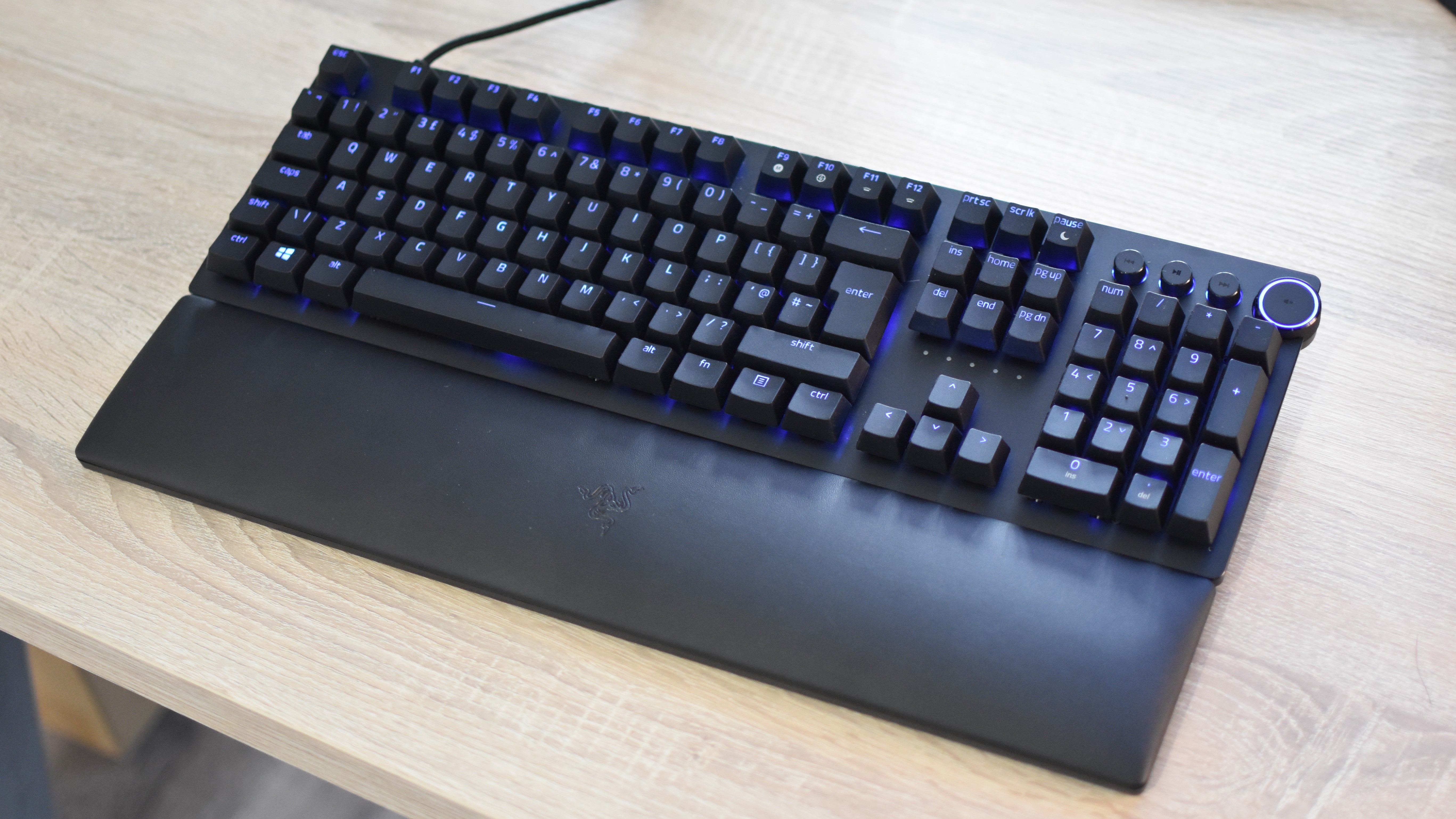 A Razer Huntsman V2 keyboard on a desk.