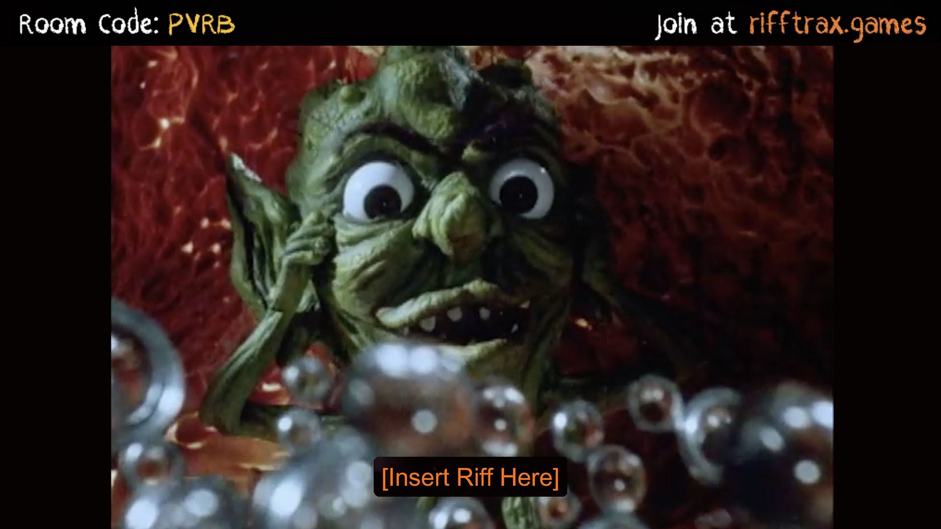 A terrible goblin in a movie with an '[Insert Riff Here]' prompt in a RiffTrax: The Game screenshots.
