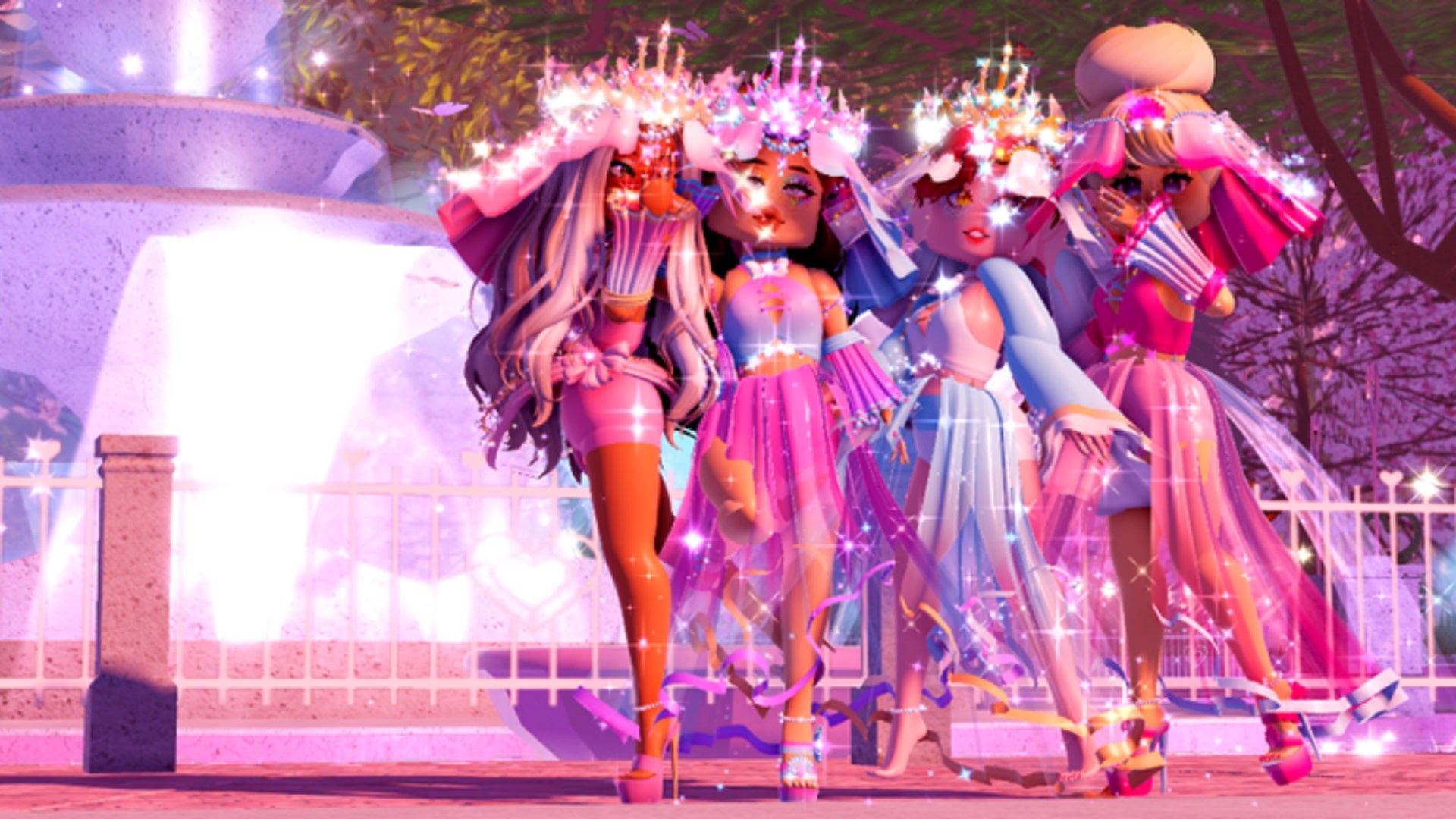 Four sparkling princesses stand in front of a courtyard fountain.