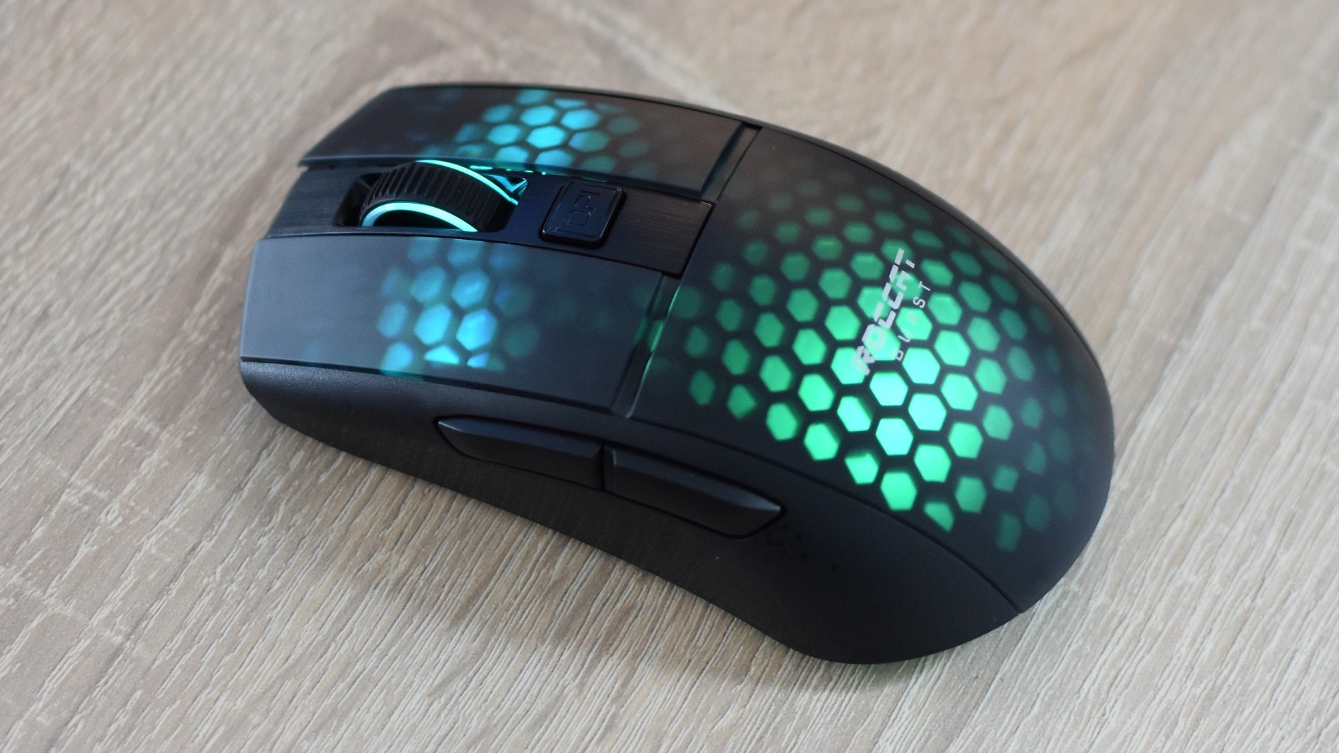 The Roccat Burst Pro Air gaming mouse on a desk.