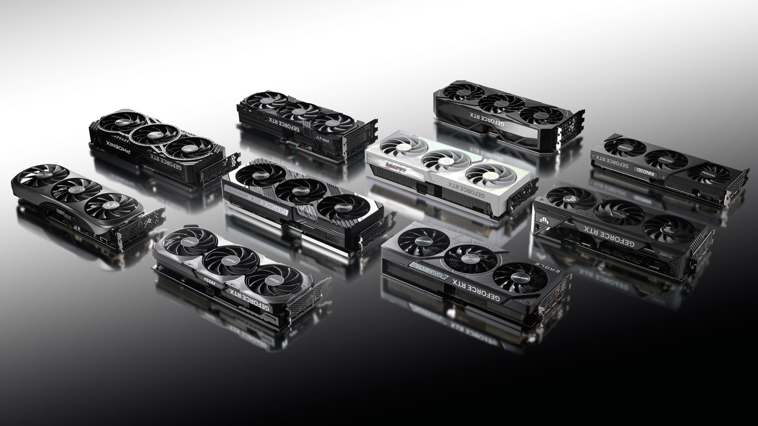 Many graphics cards laid out in black and white, showing off several Nvidia RTX 4070 Ti GPUs
