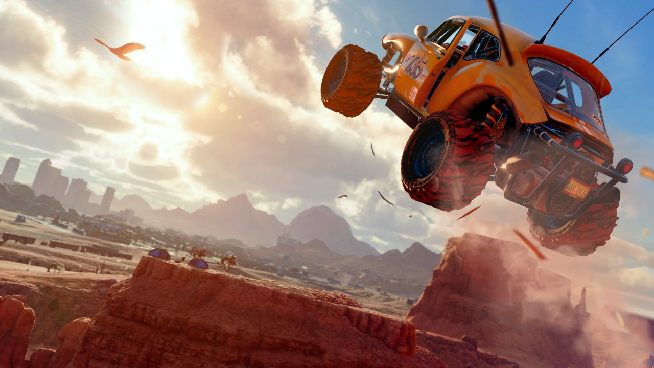 A buggy jumping over an arid desert landscape in the new Saints Row Reboot