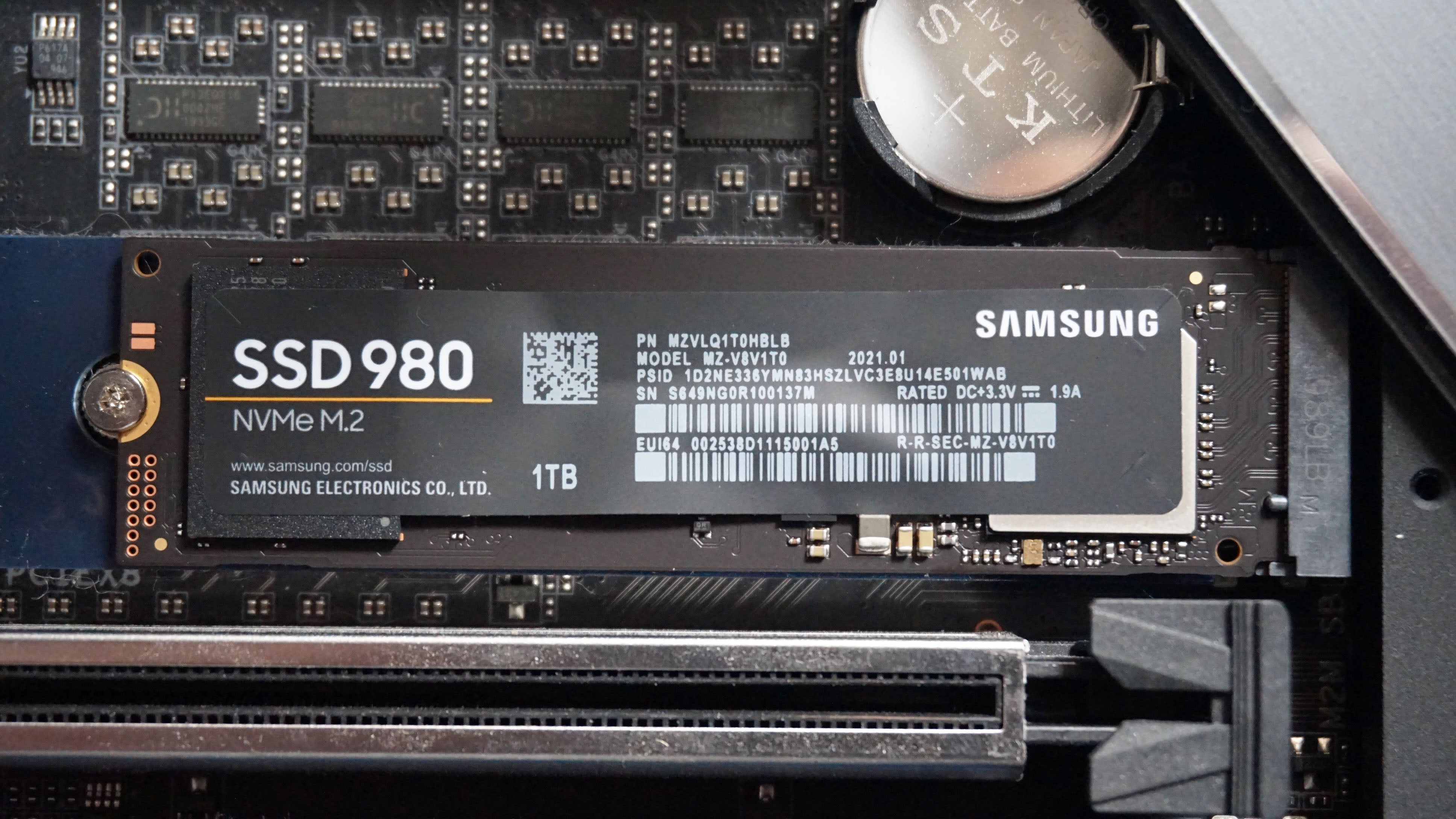 The Samsung 980 SSD connected to an M.2 slot on a motherboard inside a PC
