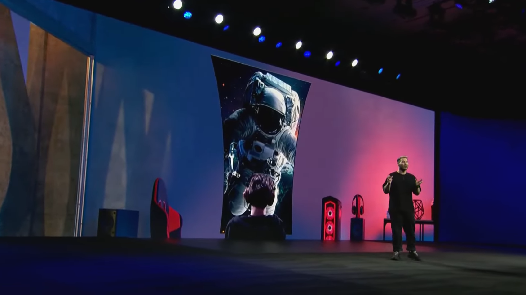 The Samsung Odyssey Ark screen appears on stage at a Samsung CES 2022 event.