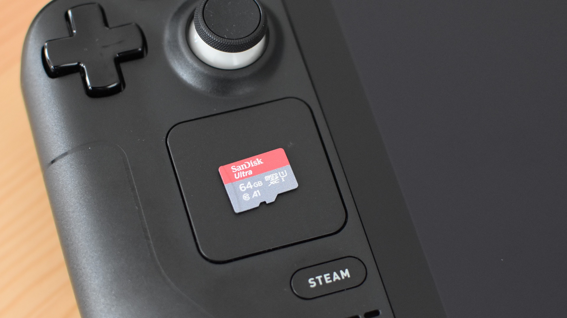 A SanDisk Ultra microSD card on top of a Steam Deck.