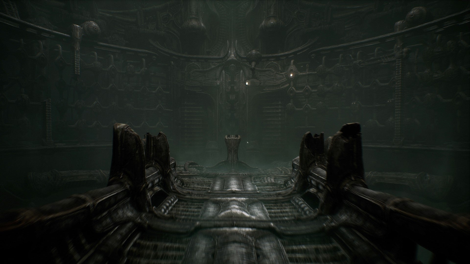 A cavernous arena in Scorn, with a lone terminal in its centre.