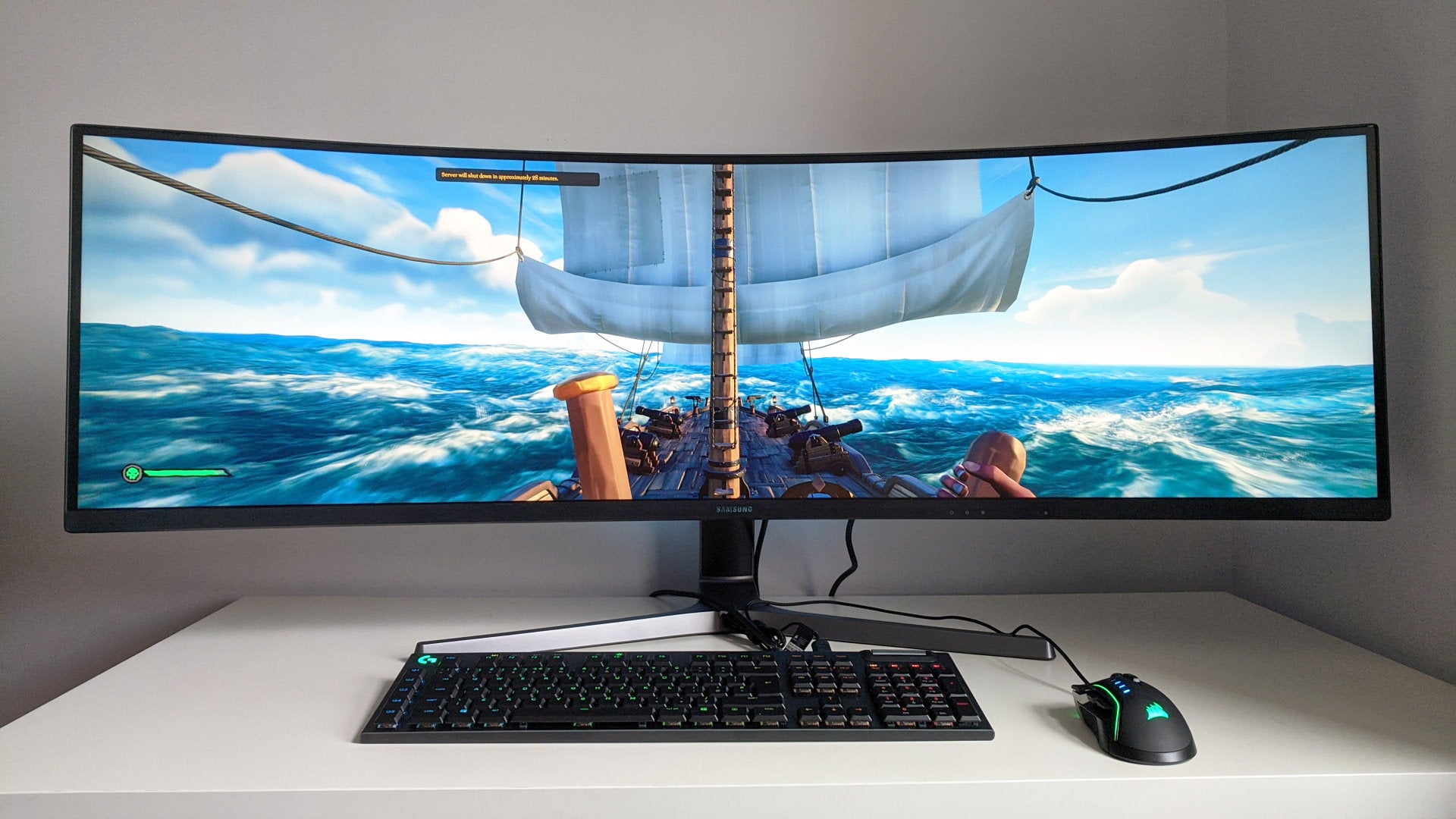 A photo of an ultrawide gaming monitor running Sea Of Thieves