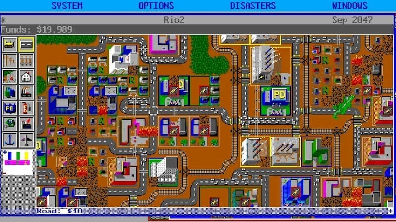 A screenshot of SimCity 1, showing buildings and road networks from a top-down perspective.