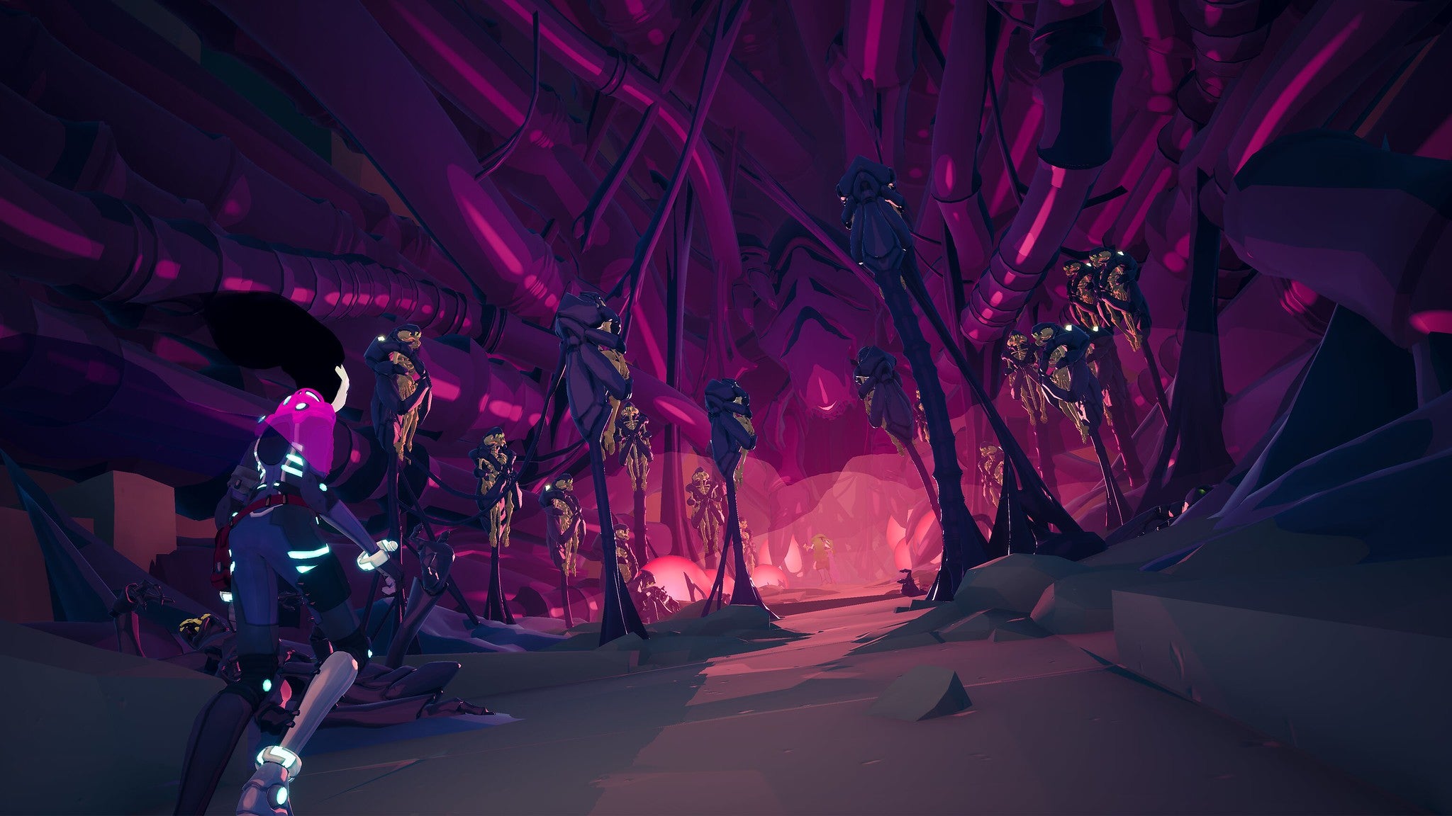 A screenshot of Solar Ash, showing the protagonist in the lower left looking into a pink and purple cave. Tubes, possibly tentacles or spider legs, hug the walls. Skeletons are held aloft, wrapped up in chitinous carcasses of bugs that seem to protrude from the ground on tendons and spikes. Sinster.
