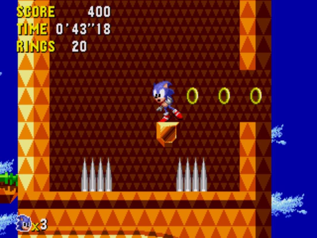 A screen of Sonic CD, Sonic standing on a small ledge between two spike traps