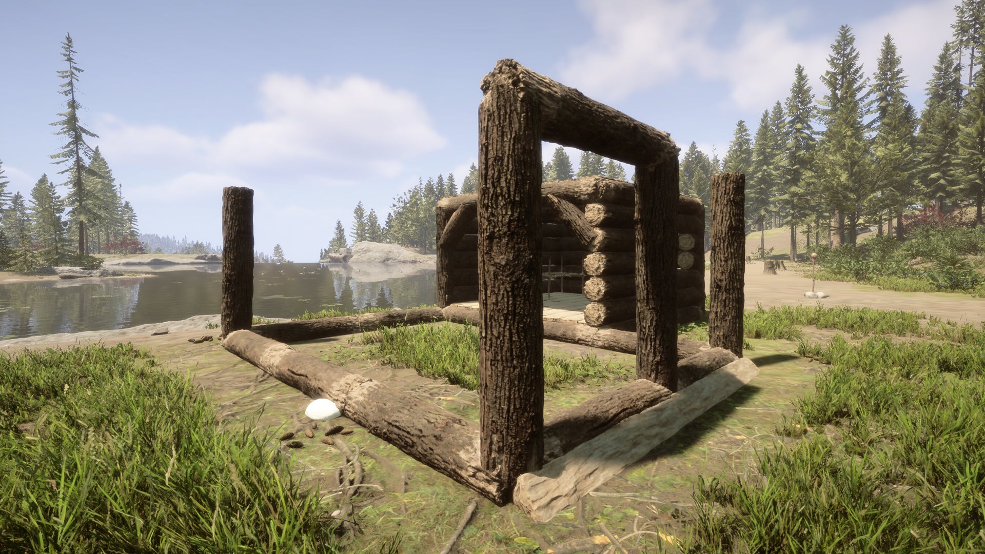 The start of a custom build house in Sons Of The Forest, located next to a river.