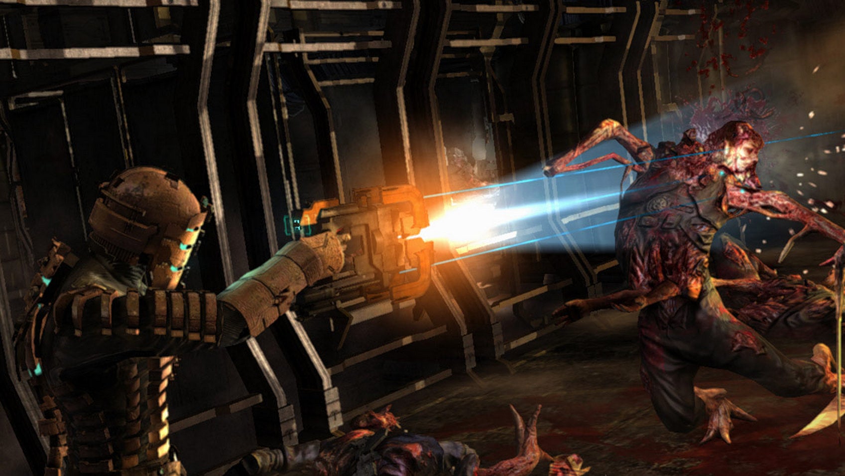 A man in a metal space suit attacks a monster with a laser cutter in Dead Space