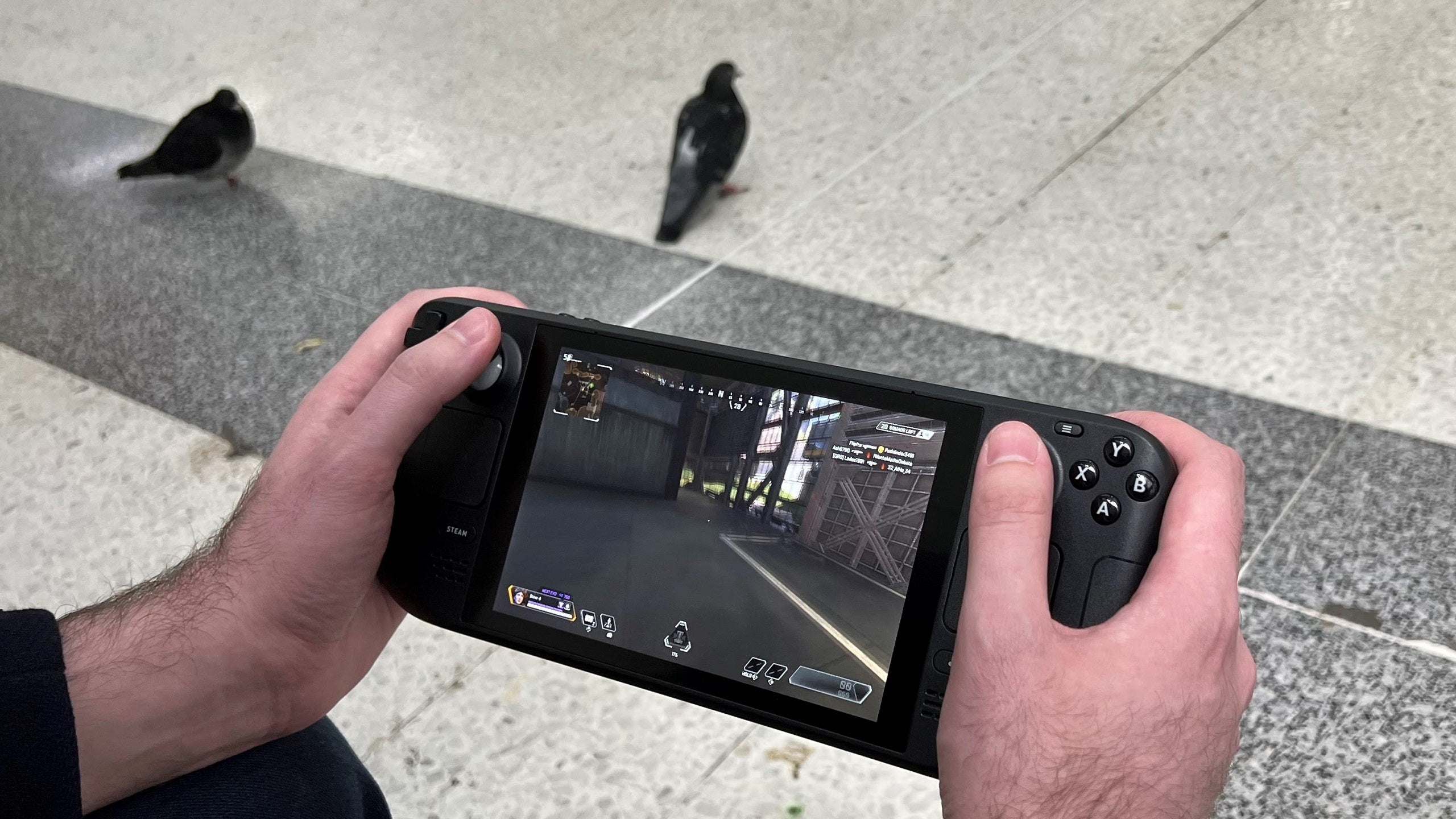 Apex Legends being played on a Steam Deck, with two pidgeons wandering around in the background.