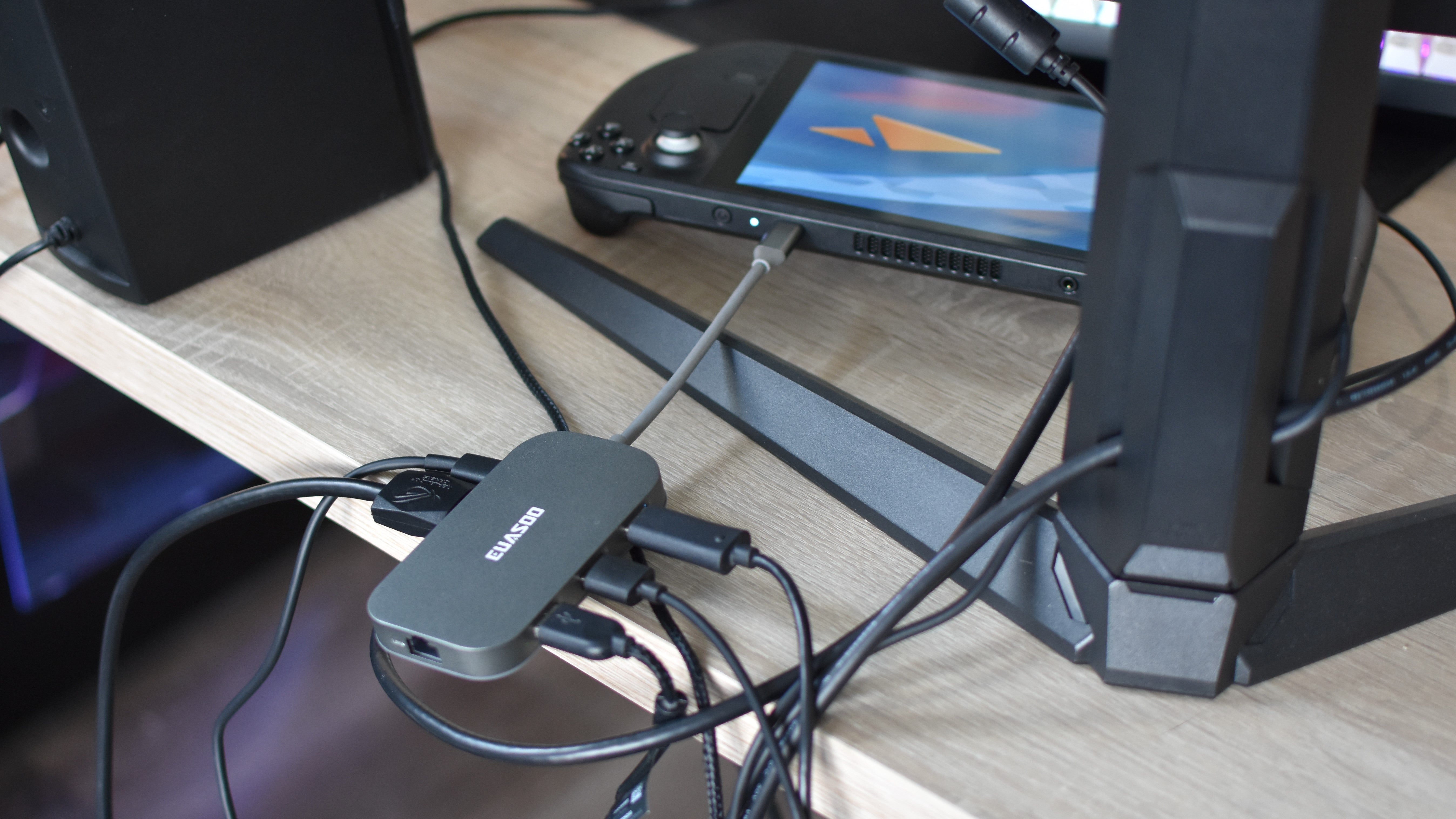 A USB-C hub connecting various peripherals, and a desktop monitor, to the Steam Deck.