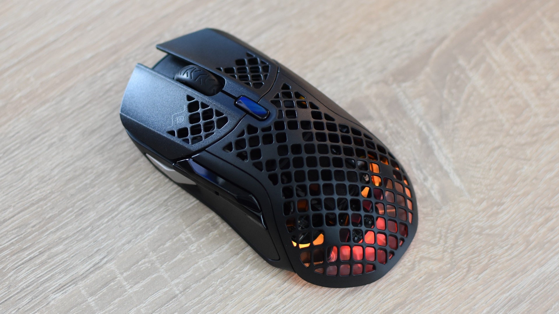 The SteelSeries Aerox 5 Wireless gaming mouse on a desk.