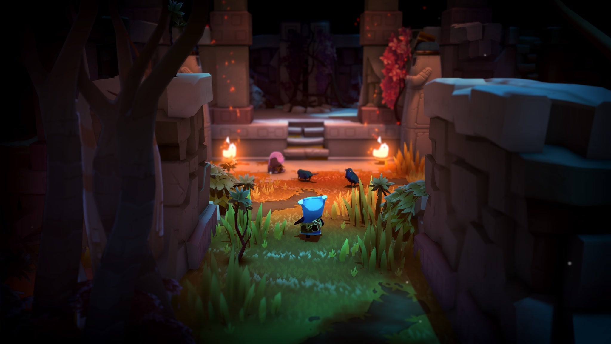 The Last Campfire - The main character Ember walks down a grassy corridor of ruins with lit torches leading to an overgrown staircase and stone door.