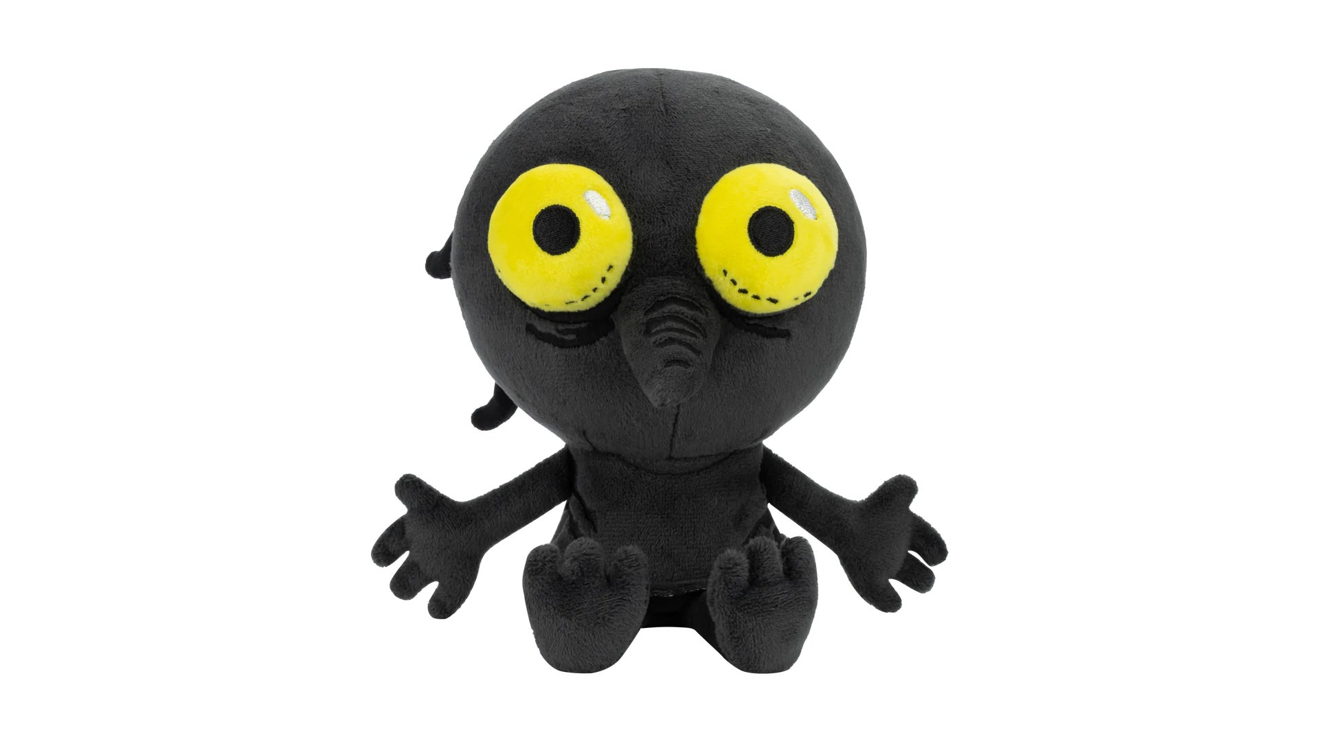 A plushie soft toy of the shade from The Longing - a little bald soot-black golbin with big bug yellow eyes