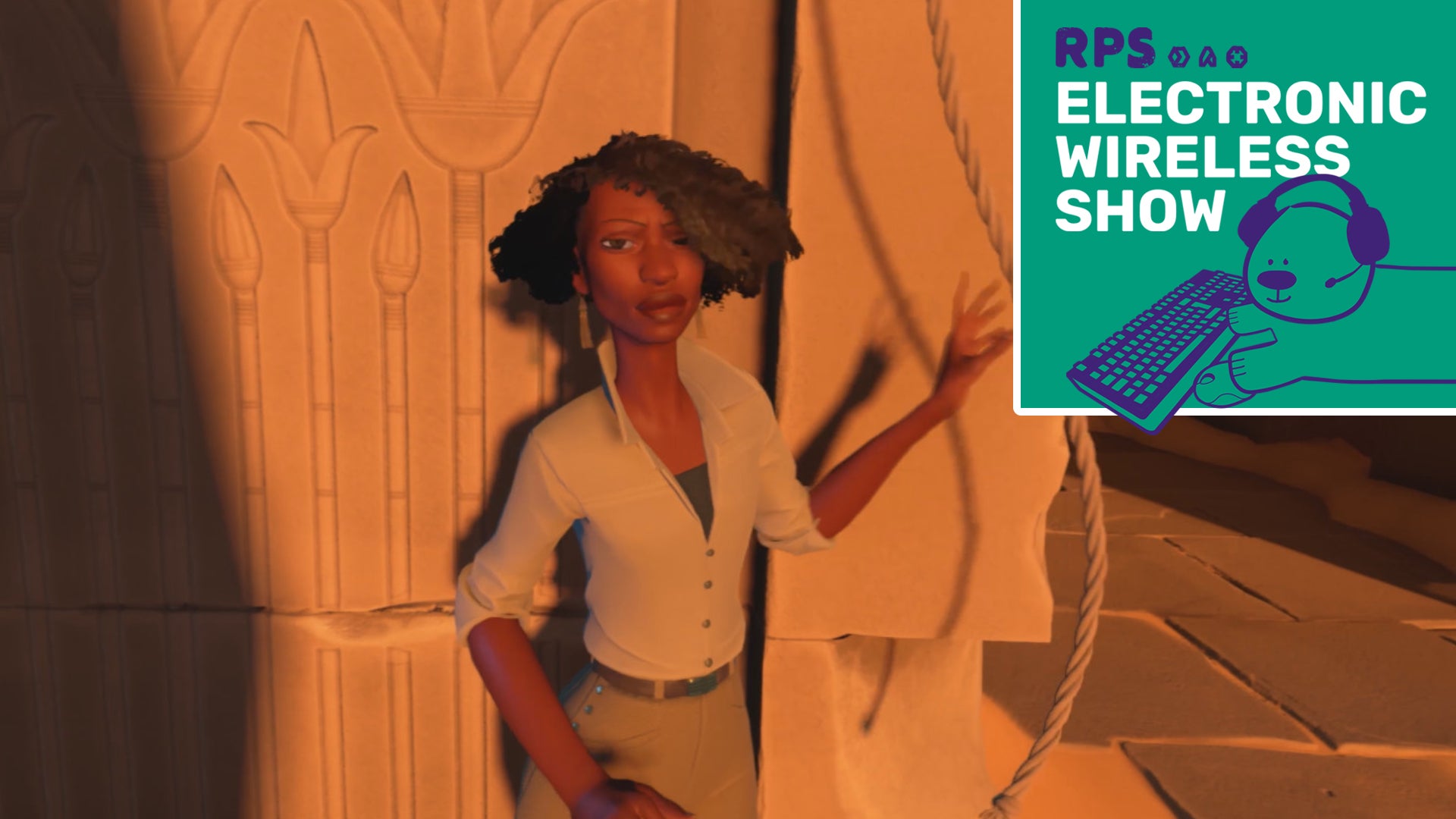 A screen from In The Valley Of Gods showing a black woman with a short bob and wearing a khaki shirt and trousers, standing at golden hour in front of part of a stone ruin. The green Electronic Wireless Show Podcast logo is superimposed over the top right corner