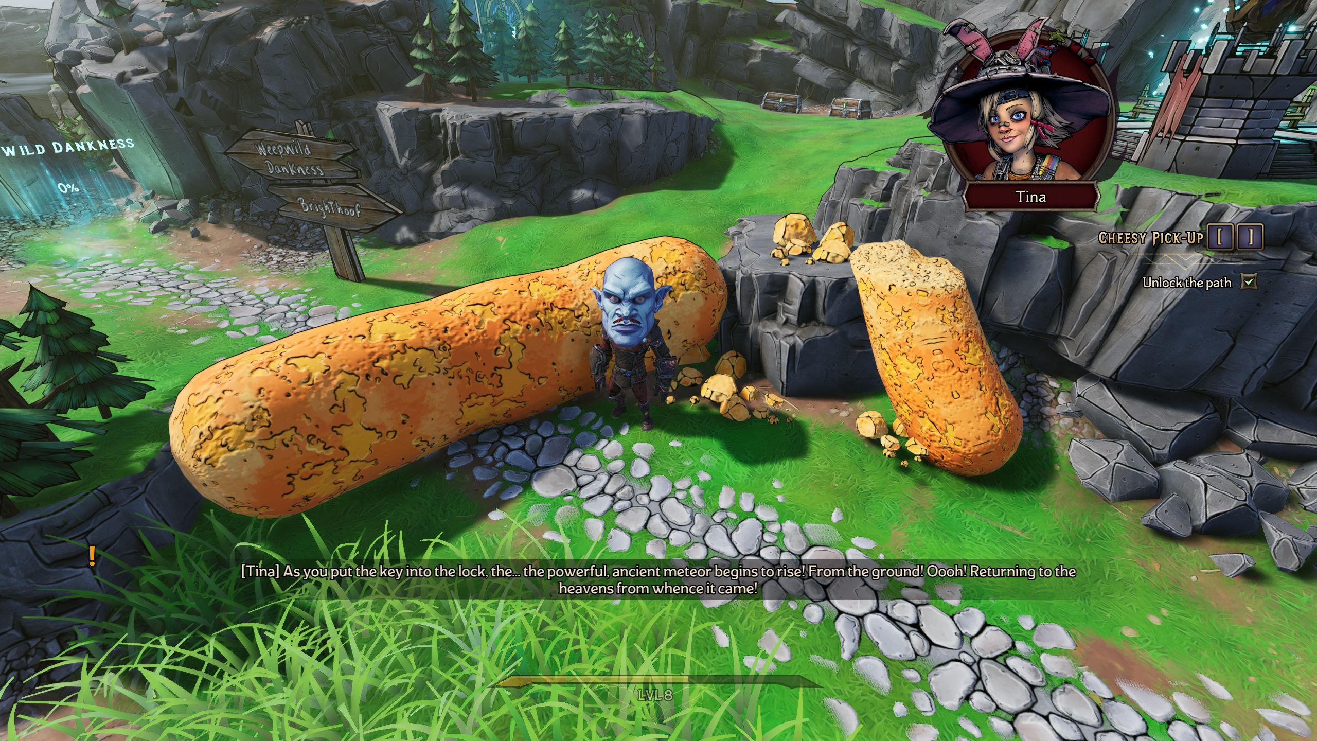 A small man with a large blue head stands next to a giant cheeso on a game board in Tiny Tina's Wonderlands